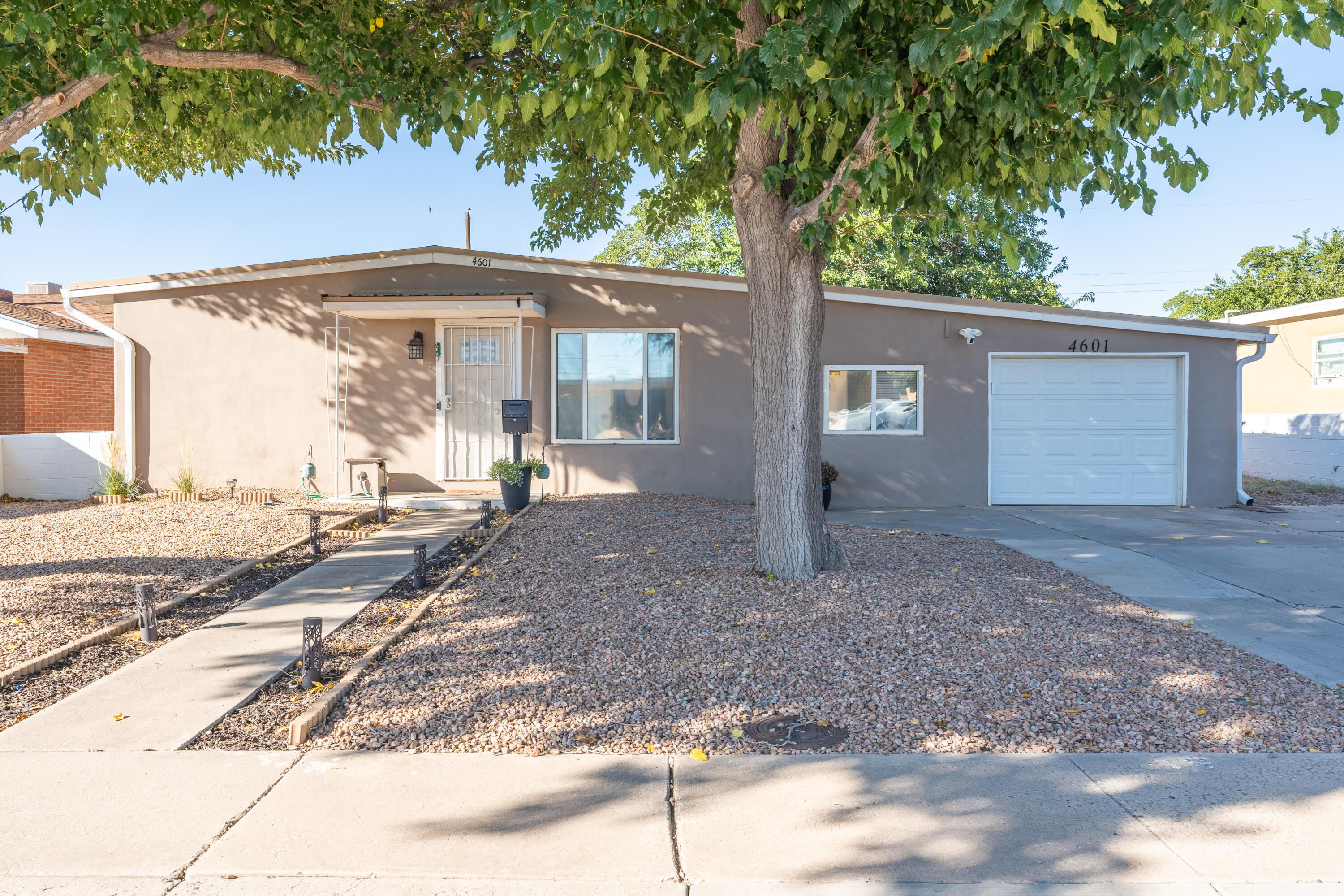 Welcome to this beautifully updated and well maintained 3-bedroom, 2-bathroom home. Featuring a kitchen with plenty of storage and two large living spaces this house is ideal for entertaining family and friends. Updates within the last 5 years include a new tankless water heater, new heating and cooling throughout the house, backyard upgrades, and an electric panel upgrade just to name a few! The large low maintenance backyard provides a stunning backdrop for  a quiet night at home or the perfect  place for outdoor celebrations. With convenient access to shopping, dining, and parks, this home combines comfort and convenience. This home is also walking distance from an elementary and a middle school. Don't miss your chance to make it yours!