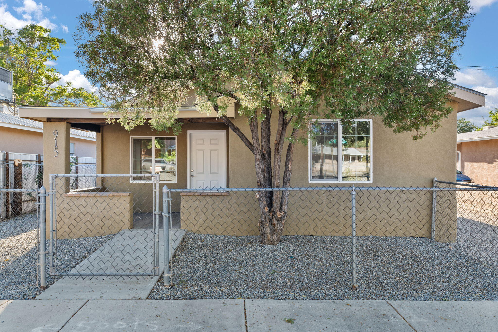 Wonderful , fully remodeled home located just a block from the Albuquerque Bio Park! Home features 1,160sf with 2 bedrooms and 2 full baths. Great front patio fully covered. Spacious living area with new laminate wood floors, recessed lights and fresh paint. Brand new kitchen with sleek white cabinetry, quartz countertops, stainless steel gas range, range hood, microwave, dishwasher and refrigerator. Custom sliding barn door leads to the service room. Both guest rooms complete with fully remodeled private baths! New refrigerated air, stucco, windows, water heater, roof and more!