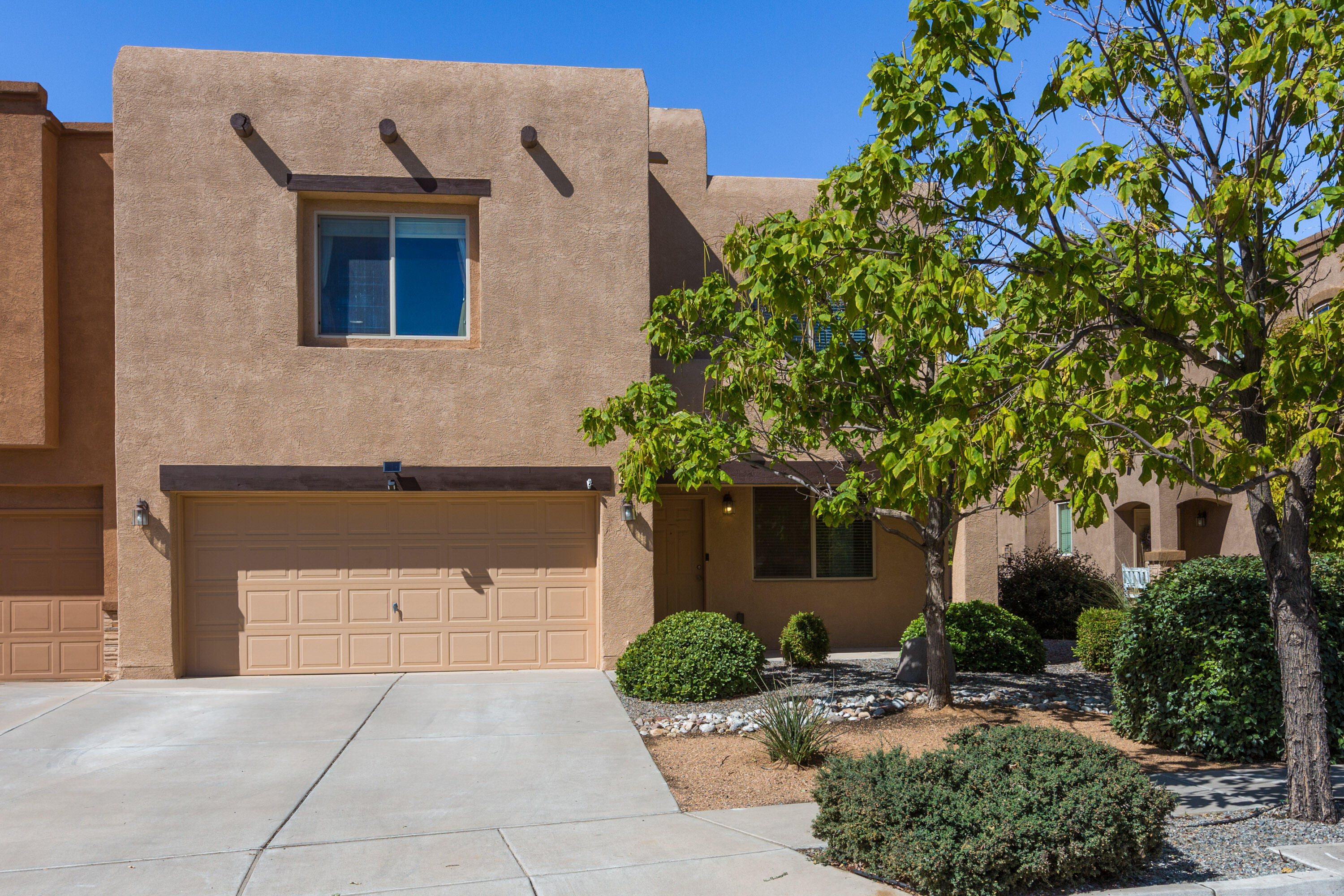 Come see this beautiful townhome in the gated community of Astante located in the Cabezon subdivision of Rio Rancho.  Granite counters in the kitchen with a beautifully updated backsplash.  Large master suite with separate tub and shower, and large walk-in closet.  Tile and wood floors are featured downstairs, and a large loft/game room is upstairs.  Cozy up next to the gas fireplace in the downstairs living room.  Enjoy one of Astante's pocket parks located directly across the street, and within walking distance to Cabezon Park featuring a local community center, pool, and playground.  Presbyterian Rust Medical Center is located nearby as well as the growing retail and restaurant developments along Unser Blvd.