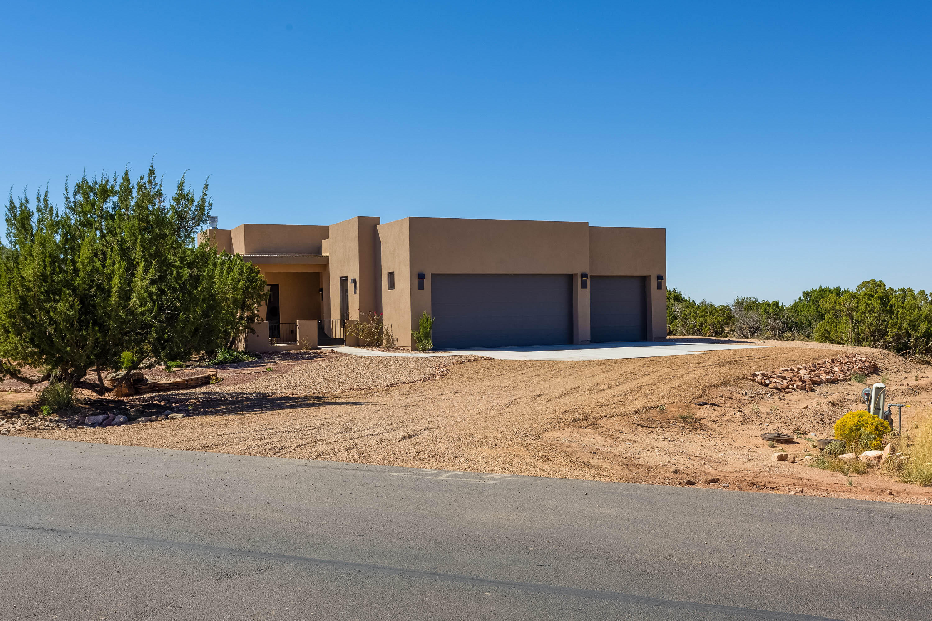 New construction, contemporary build complete with design elements and features that reflect today's architectural style, in the picturesque gated community  of Diamond Tail Ranch. From the moment you walk through the double front door you are wowed with clean lines, an abundance of natural lighting and amazing views. Whether you are a chef or casual cook the kitchen has stainless steel Bosch appliances, quartz counter tops, a beautiful walk in pantry and large center island. The kitchen is open to the living room with stone faced gas fire place and large dining area creating a comfortable space for entertaining. From the main living area you have access to three out door patios spaces one with a wood burning fire place. No carpet in this one light colored wood flooring and tile.