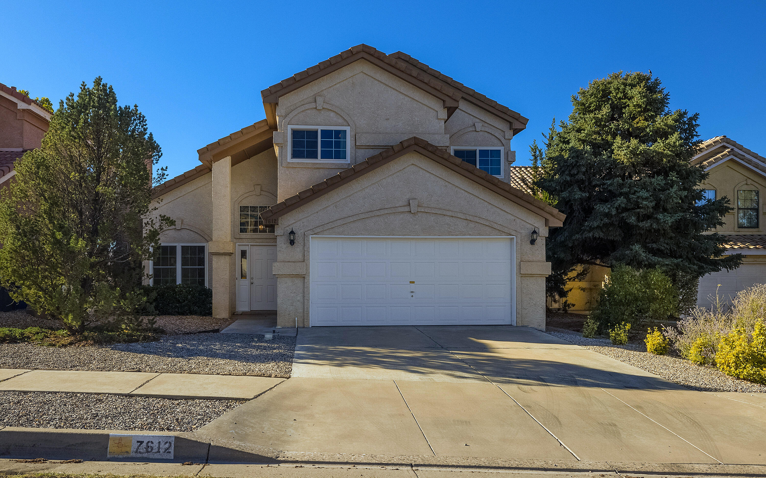 This beautifully updated home is in a prime location, just a short walk to La Cueva High School. Featuring 3 bedrooms, 2.5 baths, and a 2-car garage, this home offers a gourmet kitchen with double built-in ovens (top one is convection), a 5-burner gas cooktop, and a Vent-a-hood with outside exhaust. Energy-efficient windows and a sliding door were replaced in 2014 (low-emission, tinted). The first floor boasts engineered wood flooring, custom built-ins, and opens to a covered back patio with an outdoor grill--perfect for entertaining. Enjoy the cozy gas-log fireplace in the den during winter and refrigerated air in the summer. The spacious primary suite offers a double sink vanity, an extra-large tub with a separate shower, a large walk-in closet, and a private balcony. This is a Must SEE!