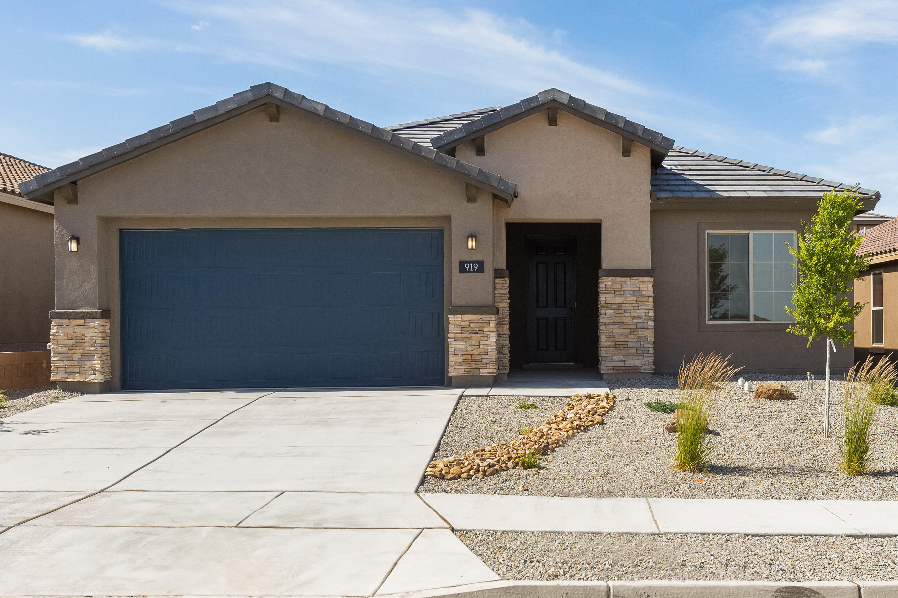 Ready Now! This brand-new Gateway floorplan has a stunning open concept creating an inviting and spacious ambiance. Step into the heart of the home, where the kitchen steals the show with its crisp white cabinets, chef kitchen built in stainless steel appliances, and beautifully tiled backsplash, creating a fresh and inviting atmosphere. The centerpiece of the kitchen is the large island, perfect for meal preparation, casual dining, or gathering with loved ones.  Large windows create natural lighting. , Every corner of this home feels warm and welcoming, creating a cozy ambiance throughout. Whether you're enjoying a quiet morning coffee or entertaining guests, this home provides the perfect backdrop for creating lasting memories. Don't miss the opportunity to make this home yours!