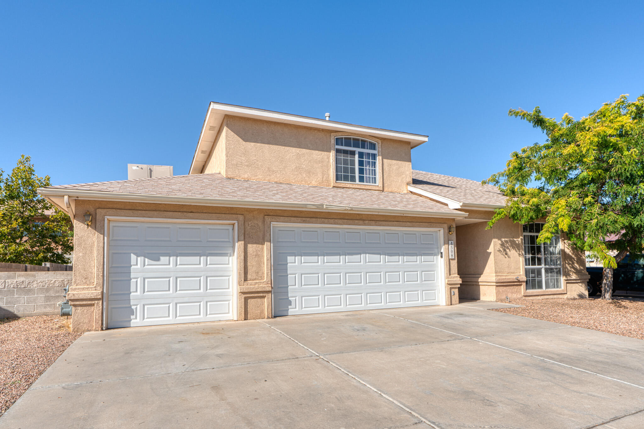 $5,000 credit to buyer's closing costs!  Welcome to this spacious 5-bedroom, 3-bath home in Paradise Hills.  Kitchen offers all appliances, an island for added workspace and bar top seating, built-in desk, tile countertops and backsplash, and a sleek pull-down faucet.  Primary suite features double sinks, garden tub, walk-in closet, tray ceiling, and French doors opening to a private deck.  Bedroom on main floor with private access to bath is perfect for guests or multi-generational living.   Spacious 3-car garage and covered backyard patio.  The expansive backyard offers a blank canvas, ready to be transformed into your dream outdoor oasis.  Convenient access to Paseo del Norte, stores, and restaurants.  Schedule a tour today!