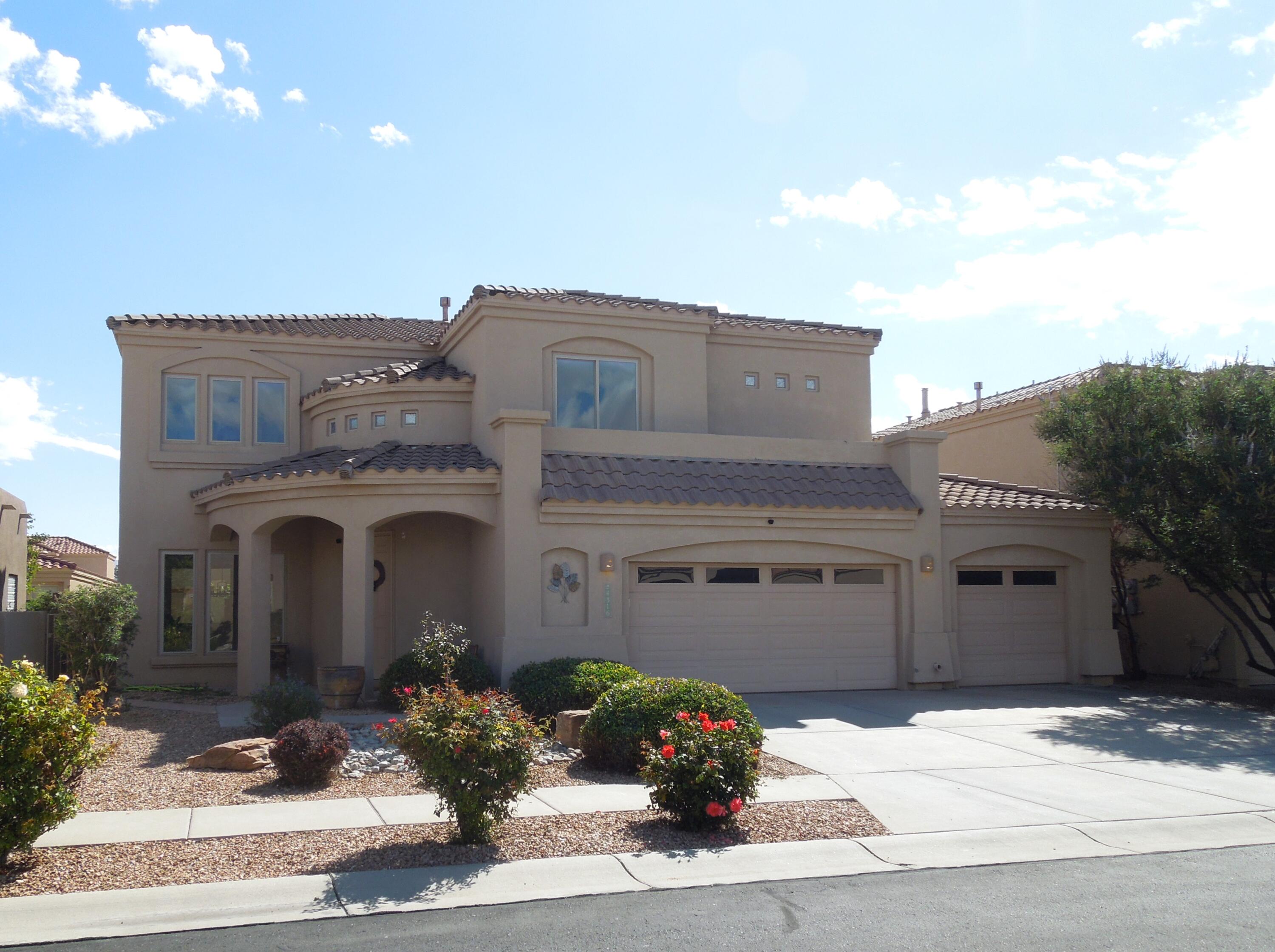 Spacious 5-bed 3-bath home in coveted gated community of Oxbow North. This ideal location sits above the Rio Grande with breathtaking mountain views from the upstairs balcony. Perfect for enjoying a cup of coffee and watching the sunrise or enjoying a quiet evening with a tranquil view of the Sandia Mountains. This home's elegant Southwestern charm begins with an arched covered entryway. As you enter, you are greeted by a bright front sitting area with large windows & high ceilings. Hand crafted wood pillars lead into a formal dining room. The spacious kitchen, with a casual dining area, overlooks the sunken living room, complete with a custom fireplace. At the top of the staircase is a landing that leads to the large primary bedroom and 3 guest beds. The 5th bedroom is on the main floor.