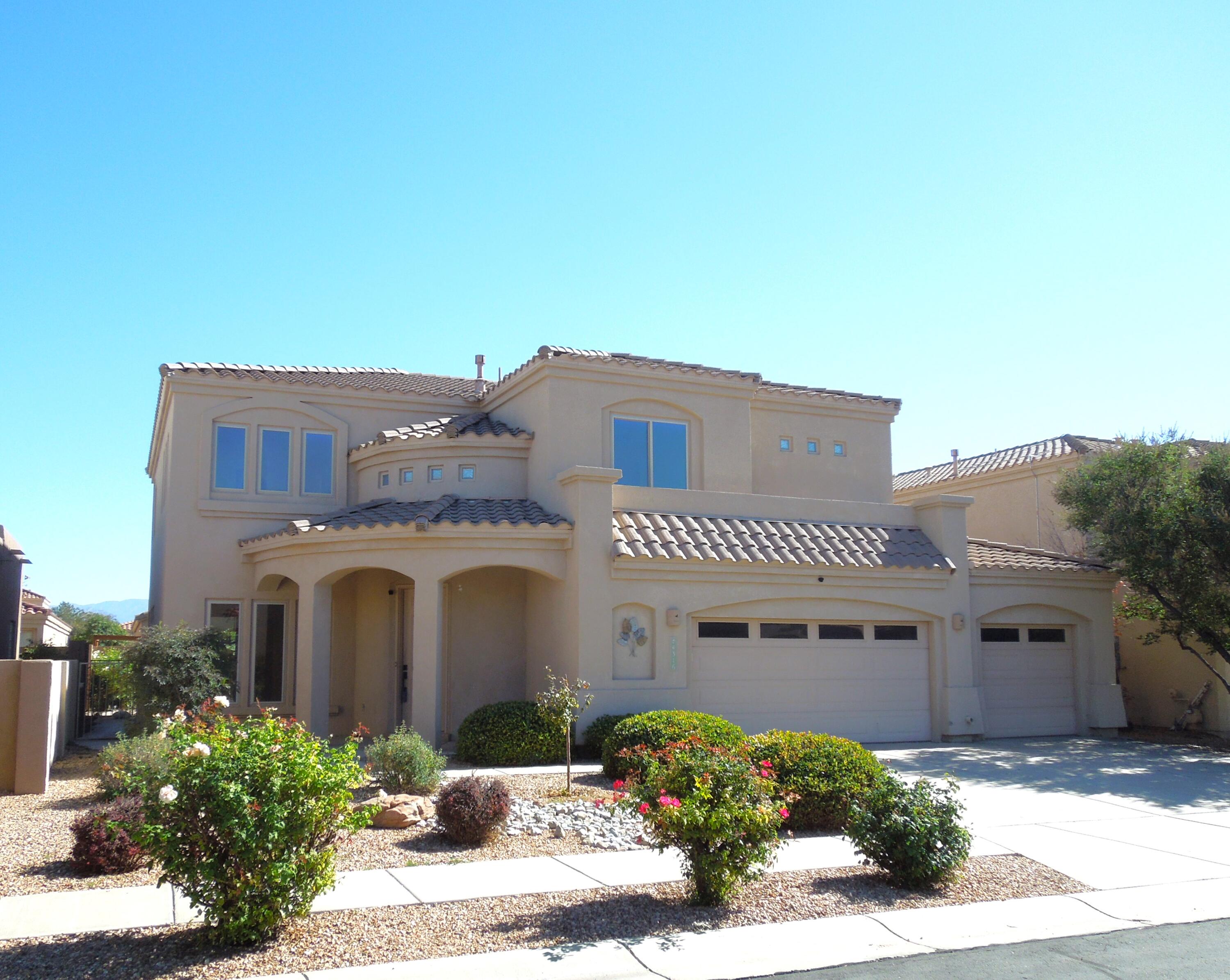 **Seller credit to Buyer upon accepted offer** Newer Refrigerated Air Unit! Spacious 5-bed 3-bath home in the coveted gated community of Oxbow North. This ideal location (Next to St. Pius collegiate preparatory school) sits above the Rio Grande with beautiful views of the Sandia Mountain from the upstairs balcony. This home's elegant Southwestern charm begins with an arched covered entryway. The bright sitting area is accentuated with large windows & elevated ceilings. Hand crafted wood pillars are featured in the formal dining room. The spacious kitchen, with room for casual dining area, overlooks the second living area, complete with a custom fireplace. At the top of the staircase is a landing that leads to the large primary bedroom & 3 guest beds with the 5th bedroom on the main floor