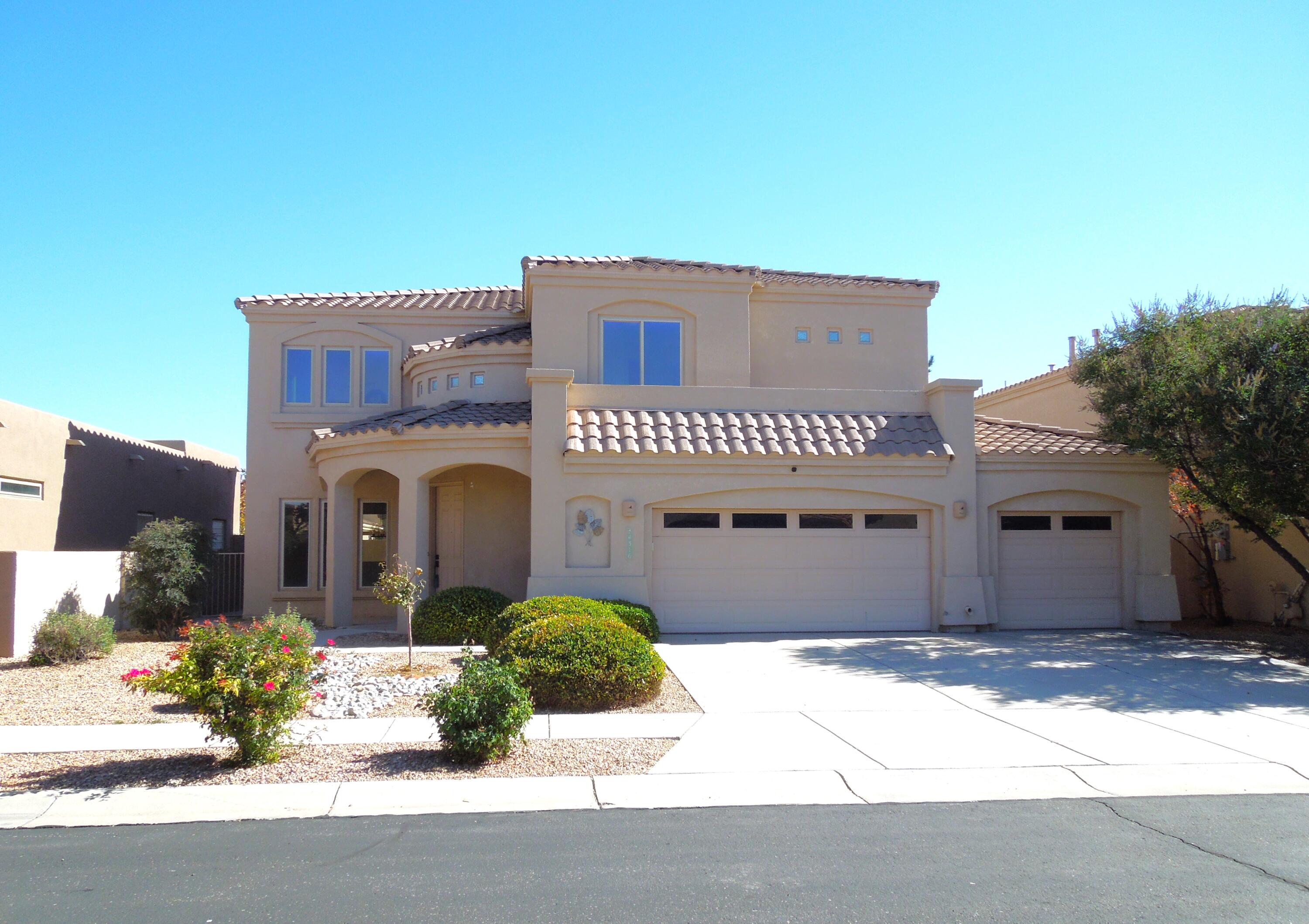 **Seller credit to Buyer upon accepted offer** Spacious 5-bed 3-bath home in the coveted gated community of Oxbow North. This ideal location (next to St. Pius college preparatory school) sits above the Rio Grande with breathtaking views of the Sandia Mountain from the upstairs balcony. This home's elegant Southwestern charm begins with an arched covered entryway. As you enter, you are greeted by a bright sitting area with large windows & high ceilings. Hand crafted wood pillars lead into a formal dining room. The spacious kitchen, with a casual dining area, overlooks the sunken living room, complete with a custom fireplace. At the top of the staircase is a landing that leads to the large primary bedroom and 3 guest beds with the 5th bedroom on the main floor.