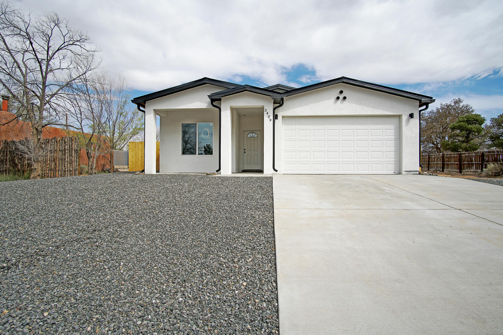 BACK ON THE MARKET!!NEW CONSTRUCTION! Come see this beautiful single story home on a half acre lot in one of the most sought after locations in Rio Rancho! This home features beautiful granite counter tops, separate dining area, kitchen island, white cabinets, primary bathroom has a separate soaker tub, double sinks and a walk-in closet, laundry room, a finished 2 car garage, partial landscape and side yard access! This home is located near restaurants, shopping centers and schools etc. Do NOT miss out on this beautiful NEW CONSTRUCTION home!