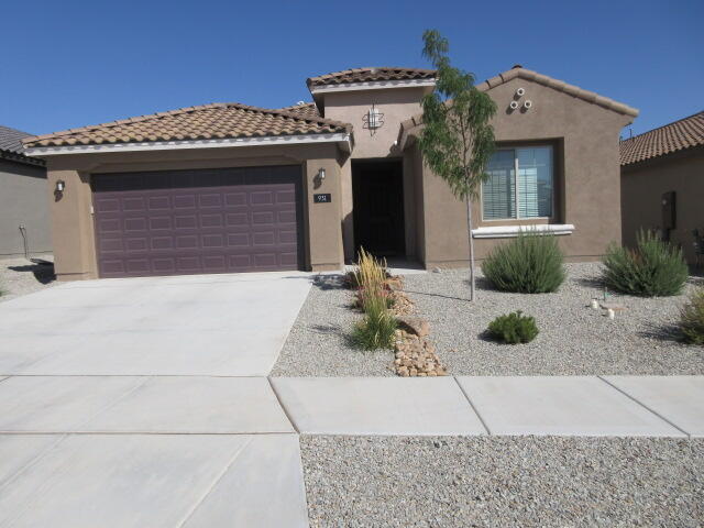 This stunning, like-new 2024 Pulte Home in Los Diamantes, near Intel and Rust Medical Center, features an elegant, modern atmosphere throughout, including an upgraded kitchen with stainless-steel appliances, a gas cooktop, dishwasher, high-grade white cabinets, a striking tile backsplash, and quartz countertops; a spacious great room; three bedrooms; and two baths, with the owner's suite bath offering a retreat-like oversized, culture marble shower and built-in bench for comfort. Tile flooring in neutral tones adds style throughout, with upgraded carpet in bedrooms, while the bright gathering room flows seamlessly between the kitchen and dining areas for perfect hosting. Tankless water heater, Complete with a 3-car garage featuring an EV charging station, landscaped front yard with a drip