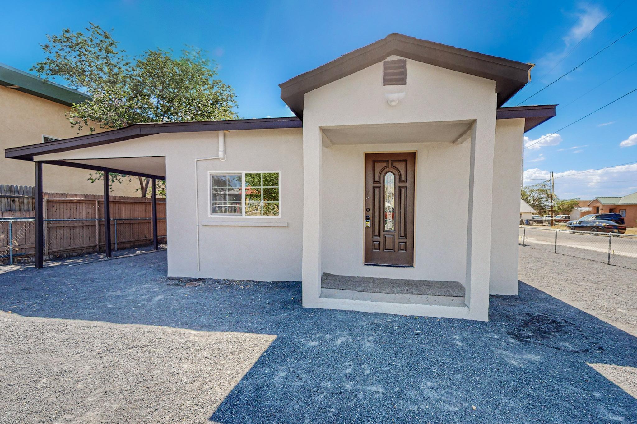 This lovely home sits on a large corner lot in the heart of downtown Albuquerque. This is a 2 bedroom, 2 bathroom, fully renovated property with new plumbing, electrical, stucco, new roof, mini split heating & cooling. Updated kitchen with stainless steel appliances and updated bathrooms w/bluetooth light speakers! Extra room for more storage, garage, or addition! Seller to give $5000 towards rate buy down with an acceptable offer! Come see this home today- You will not be disappointed!!