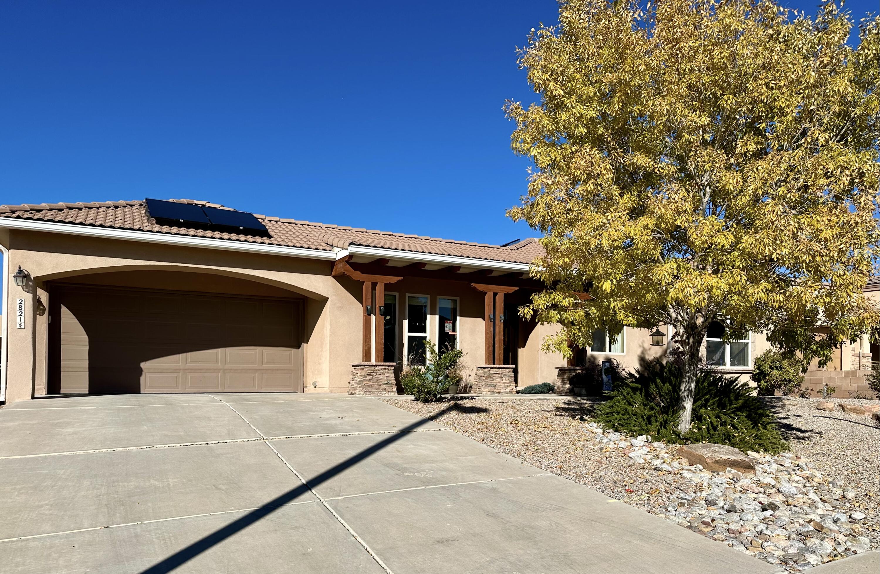 ** Open house Saturday & Sunday 11/16-11/17, 11-2pm**. This stunning, single-story semi-custom home with Solar Panels in Cabezon offers a blend of luxury and convenience. Featuring a 4-bay garage, the home includes a spacious kitchen with custom cabinets, granite countertops, and a walk-in pantry, perfect for any home chef. With four bedrooms and a dedicated workspace area, there's plenty of room for comfort and productivity. The oversized primary bathroom boasts a luxurious shower with a bench seat, adding to the home's thoughtful design. Additional features include a water softener, tankless water heater, and central vacuum system. The landscaped yard offers ample space for outdoor enjoyment, and the property is conveniently located close to shopping and dining options.