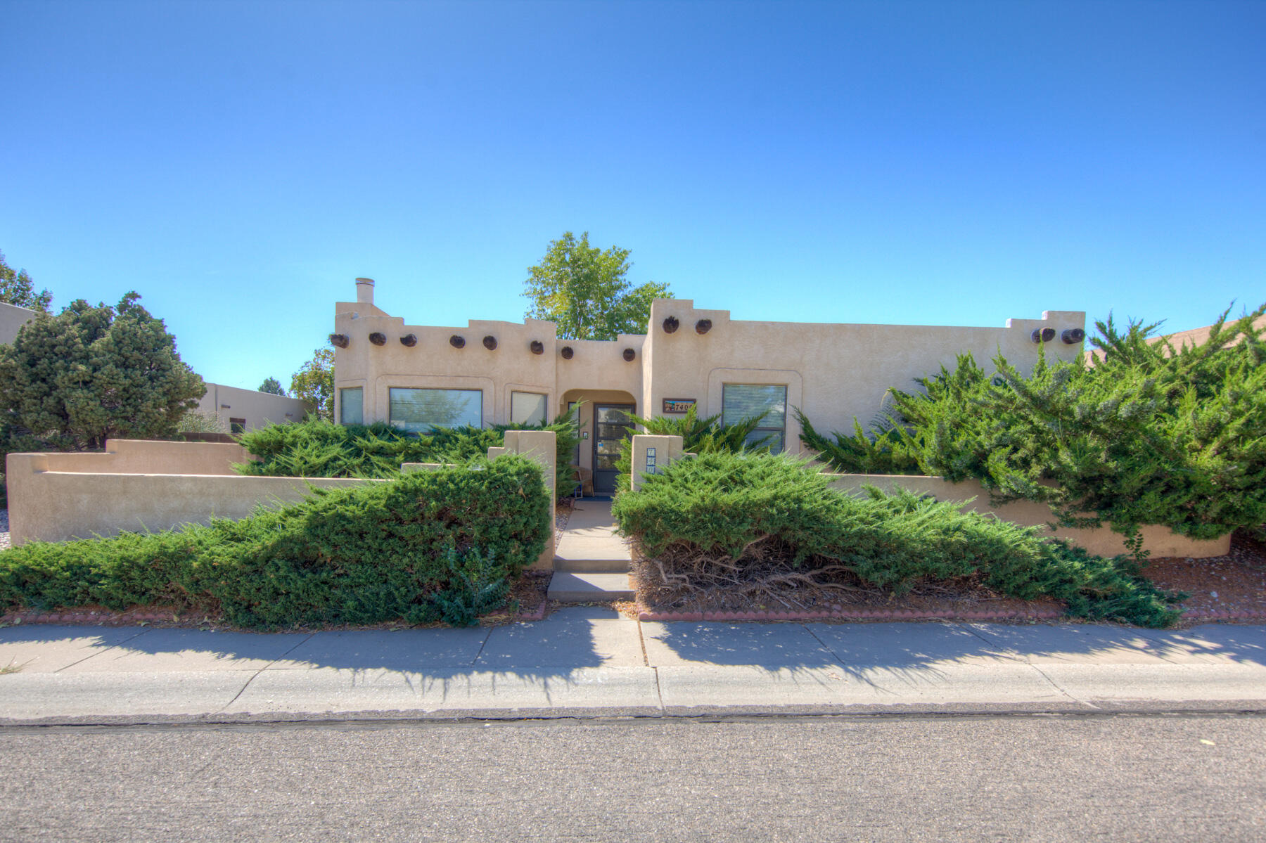 Welcome to this One-Story 3 Bedroom, 2 Bathroom, 1504 Square Foot Home w/ a 130 Square Foot Sunroom that is not included in the Square Footage! The Roof was Replaced in 2020! It Offers Refrigerated Air, Front Courtyard, Great Room w/ a Gas Log Fireplace, Dining Room, Breakfast Nook and the Kitchen has Abundant Cabinet and Counter Space and a Pantry! The Primary Suite Includes Double Sinks and a Walk-In Closet! There are Ceiling Fans and Skylights Throughout.  The Low Maintenance Backyard is Private and also has a Side Yard for More Space!  The Finished 2 Car Garage is Accessible Through the Alley and Has a Workbench!