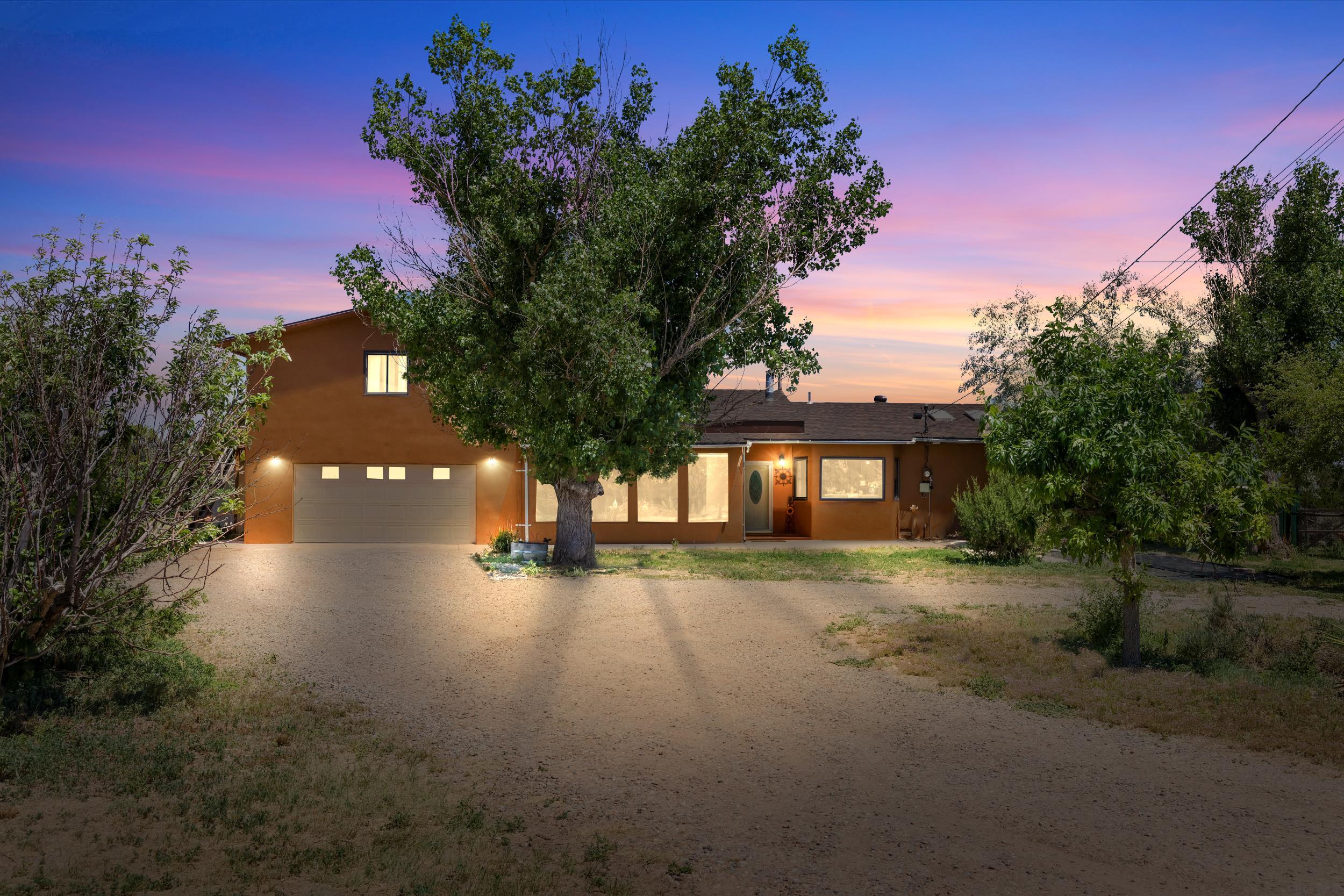 Discover your dream home in breathtaking Edgewood, NM! Easy highway access and just 25 minutes from Albuquerque, this stunning 4-bed, 4-bath detached property rests on a sprawling fully fenced 10-acre lot. Recent renovations include a new roof, stucco, fresh paint, and new mini splits for efficient heating/cooling. The bathrooms boast new shower surrounds and modern vanities, while the kitchen dazzles with stainless steel appliances. Enjoy worry-free living with new tankless water heaters and a septic system upgrade. The vast outdoor space includes apple and pear trees, and is perfect for gardening, recreation, or keeping horses. Peaceful rural living meets convenience with nearby amenities. Don't miss this meticulously updated home in an idyllic setting! Schedule a showing today :)