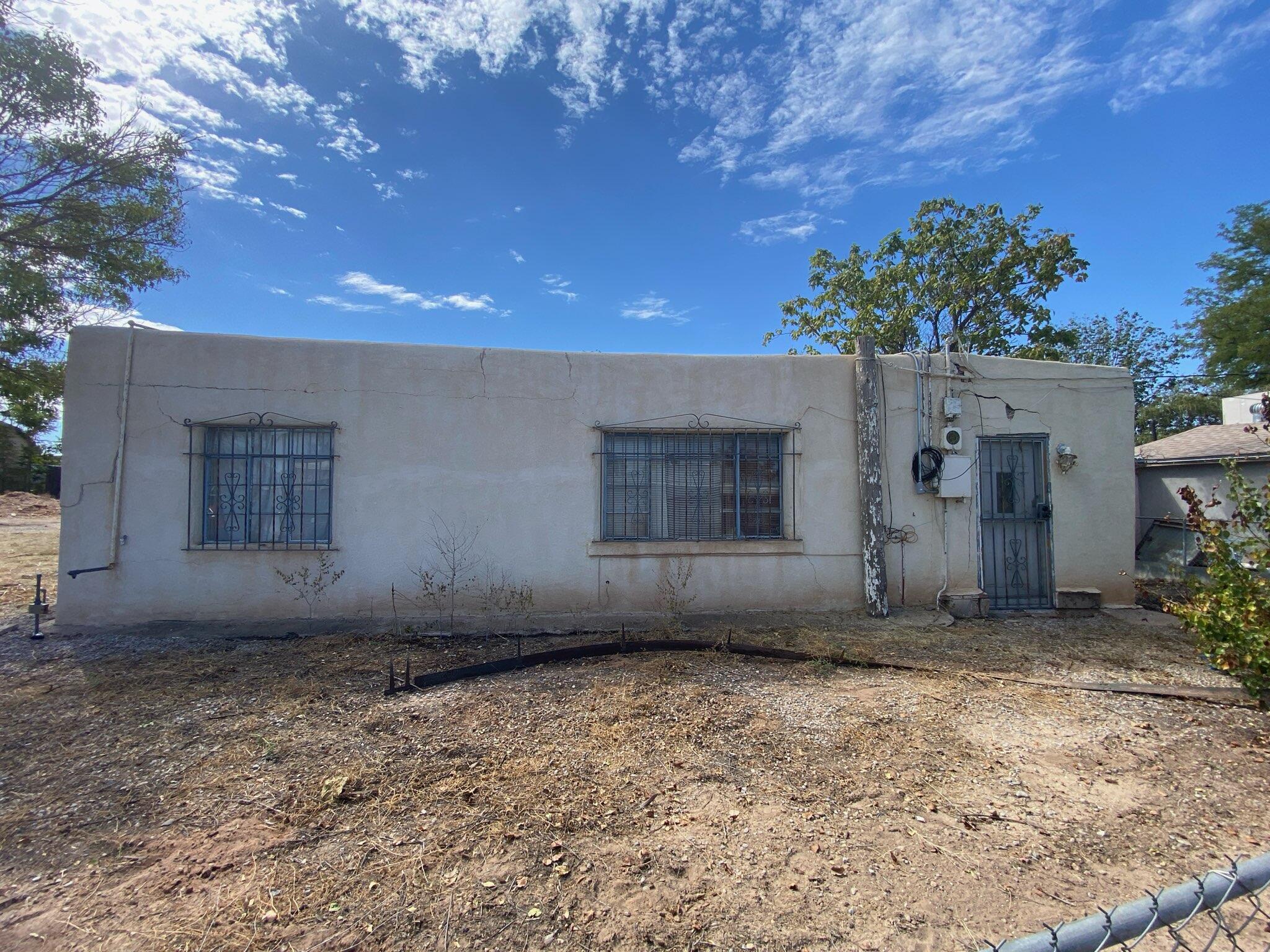 SELLER IS OFFERING BUYER CONCESSIONS with a competitive offer! Ready for your next project in a highly desirable North Valley location? This fixer-upper is full of potential, offering the chance to create your dream oasis. Bring your animals and toys--there's plenty of space on the large lot, which also boasts stunning Sandia Mountain views from the front. Close to many amenities, including shops, restaurants, local businesses, and more. With some TLC, this property can become the perfect personal home or a great investment. Don't miss out on this gem with endless possibilities!