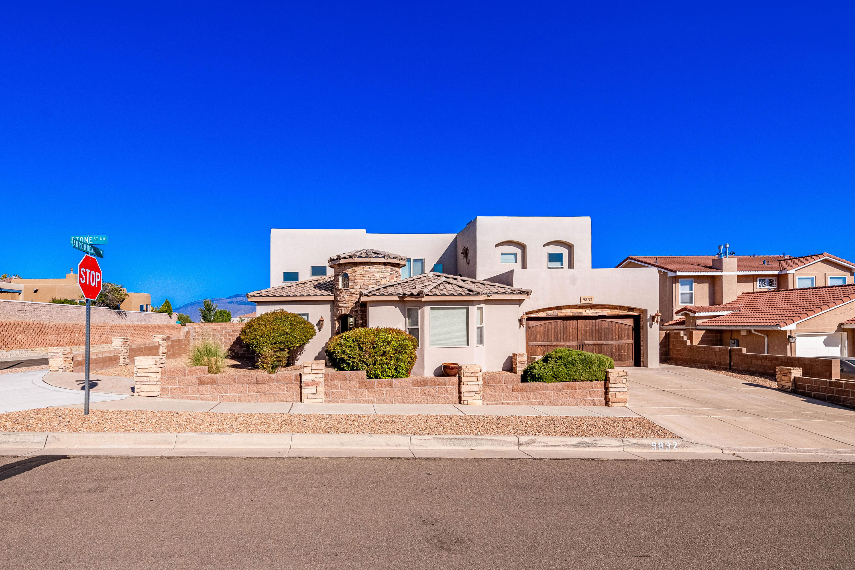 Beautiful Tuscan style custom home sits on a quiet corner lot in the Knolls of Paradise Hills with amazing mountain views and city views! Experience in & outdoor living at its BEST in this 4 bedrooms, 3 bathrooms, 2 car tandem garage featuring laminated wood flooring accented with gorgeous travertine. The kitchen boasts granite countertops, stone tiled backsplash, Stainless steel Jenn-Air appliances with peninsula bar. The private outdoor courtyard is perfectly placed and accessible from the kitchen, dining and theatre room (possible 5th bedroom). Newer roof and AC units installed, newer stucco coat and upgraded features make this home a true winner!