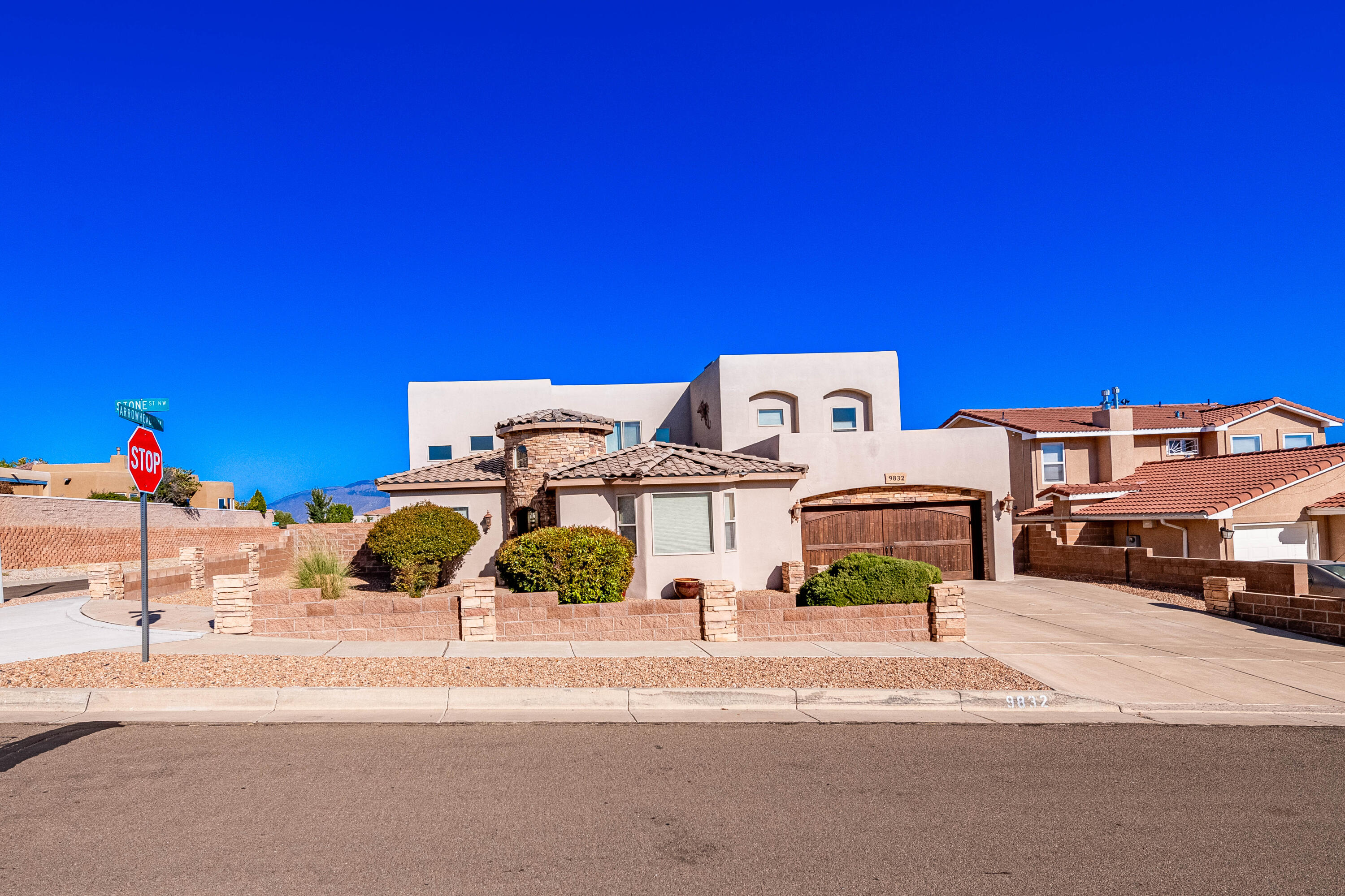 Beautiful Tuscan style custom home sits on a quiet corner lot in the Knolls of Paradise Hills with amazing mountain views and city views! Experience in & outdoor living at its BEST in this 4 bedrooms, 3 bathrooms, 2 car tandem garage featuring laminated wood flooring accented with gorgeous travertine. The kitchen boasts granite countertops, stone tiled backsplash, Stainless steel Jenn-Air appliances with peninsula bar. The private outdoor courtyard is perfectly placed and accessible from the kitchen, dining and theatre room (possible 5th bedroom). Newer roof and AC units installed, newer stucco coat and upgraded features make this home a true winner!