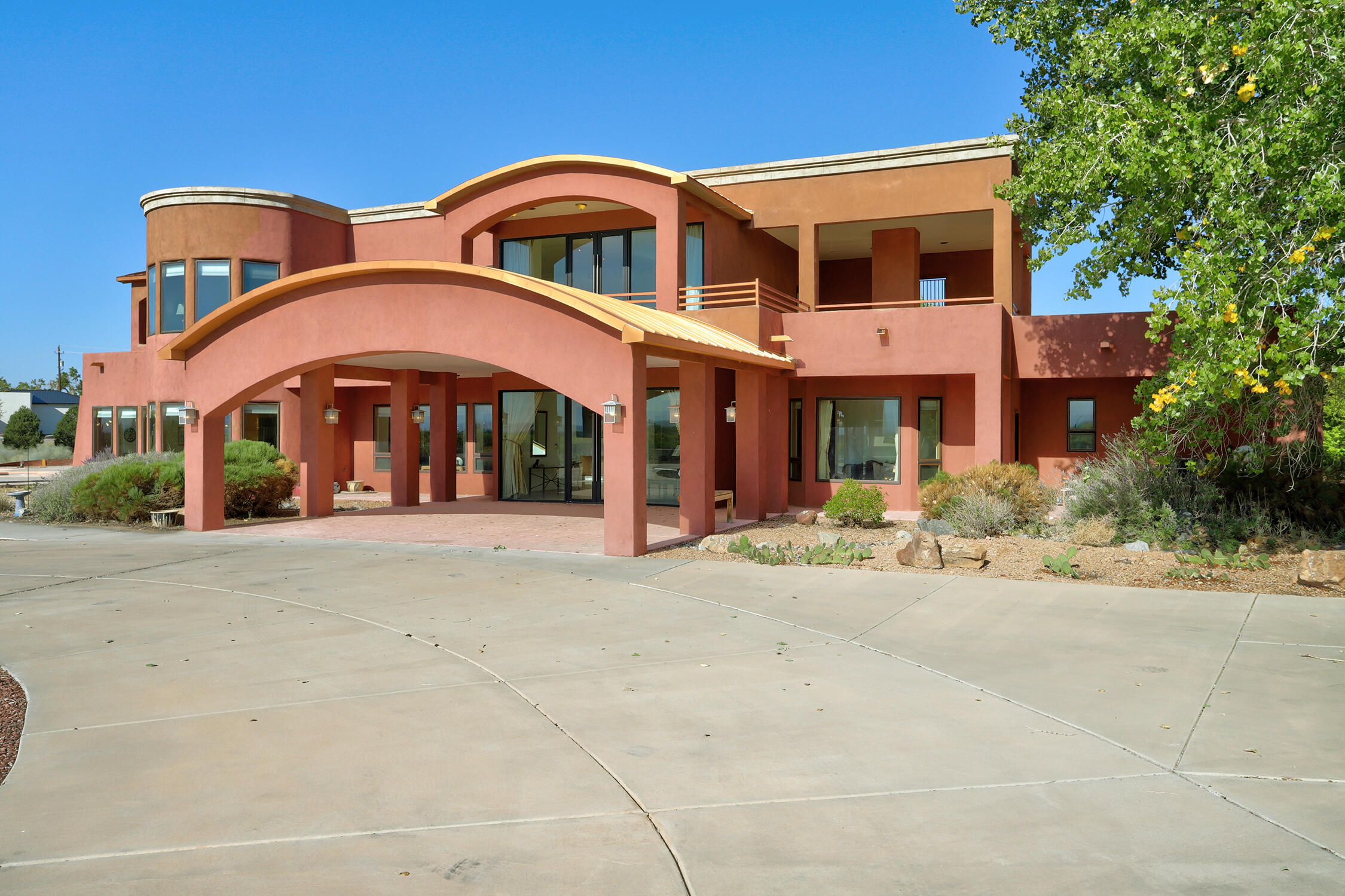 Welcome to this rare opportunity to own an extraordinary custom-built home, originally designed as a spacious 3-bedroom retreat but easily adaptable to offer up to 7 bedrooms! Situated on 3.97 acres in the exclusive Alban Hills area, this property boasts one of the world's most spectacular views, with the majestic Sandia Mountains as your daily backdrop. You'll witness the bosque's beauty as it transforms through the seasons and enjoy an exclusive front-row seat to the Albuquerque International Balloon Fiesta. By night, the sparkling city lights create a stunning backdrop, perfect for both relaxation and entertaining.  Despite its private and tranquil setting, this home is conveniently near a variety of amenities, offering the perfect blend of privacy and accessibility.