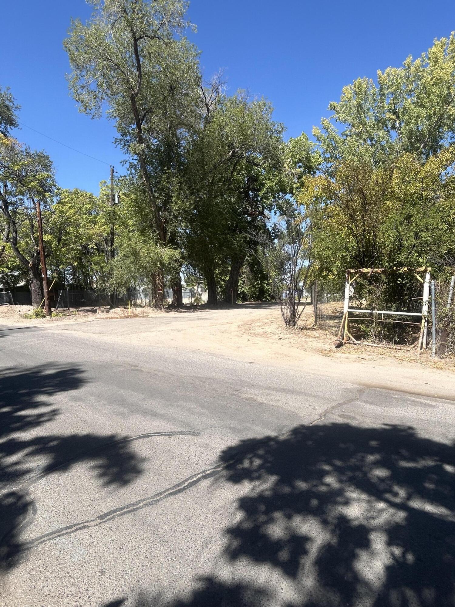 Hard to find buildable lot in a serene rural south valley setting only minutes from downtown and easy access to I-25. Currently platted as 1 lot that is approximately 2.38 acres lot but seller will have it subdivided with an acceptable offer. Seller has run natural gas, water, sewer and electric to the property. Seller has approved plans for a 2,300 +-sq. ft. home and trusses delivered if someone wants to finish the rest. Seller will consider owner financing. A lot of potential here: Build a home and have some acreage or subdivide and have potentially 4 lots. Call your broker today to see this property!