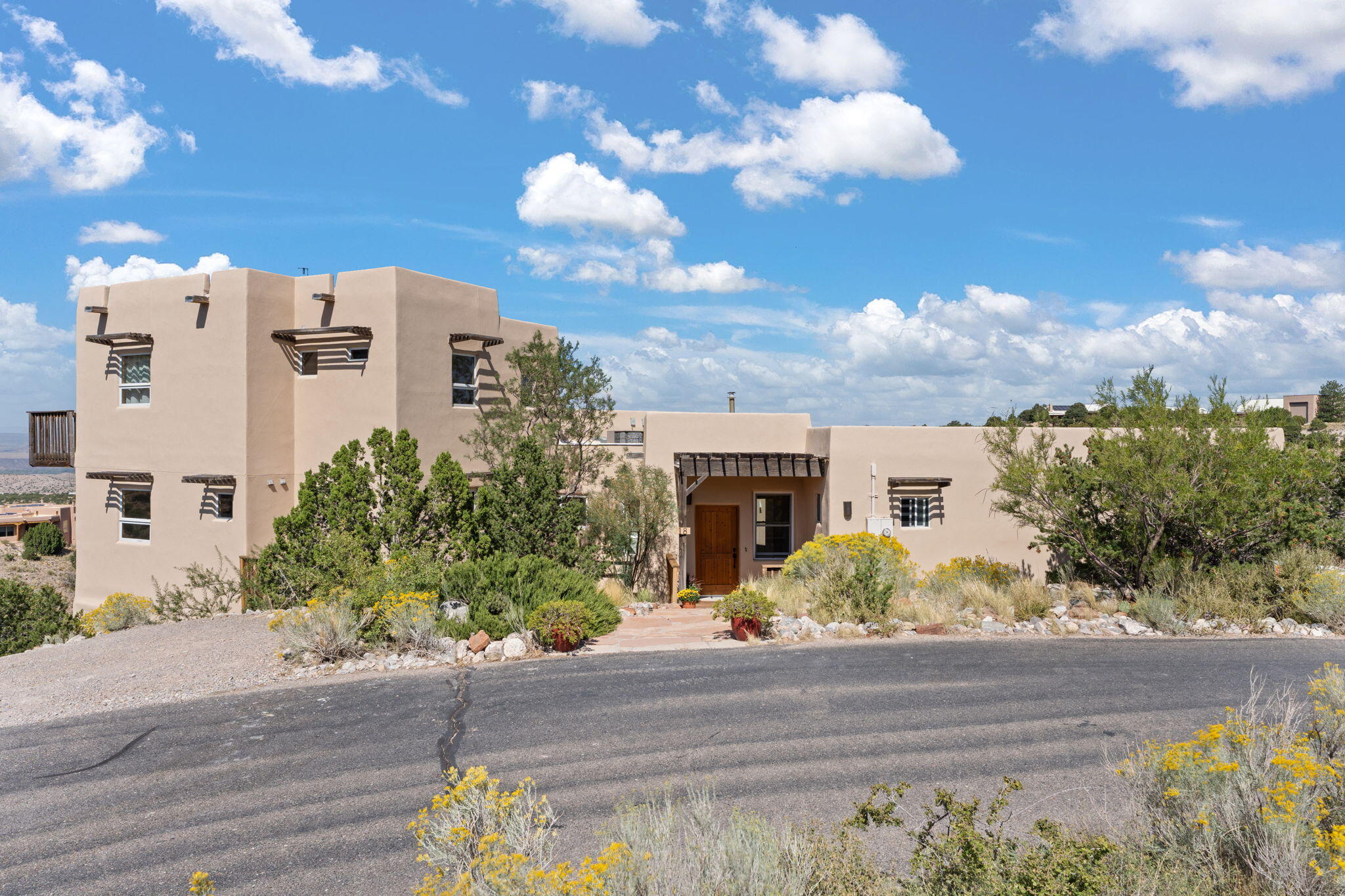 VIEWS! VIEWS! VIEWS! $875,000. Incredible sunsets from this 3900 sq ft home in The Overlook! Private, custom built home situated on over 6 ACRES! Large wood windows, radiant heat, refrigerated air, TPO roof, beautiful tiles floors & no carpet! Bright, comfortable kitchen with granite counters, gas stove & walk-in pantry. Dramatic views of the Jemez Mtns & mesas, etc., from nearly every window! Private primary suite is on upper floor, has oversize tub & separate shower. Main floor has kitchen, dining, living rm, 2 bedrooms, oversize 2 car gar & entry. Downstairs is 1440 sq ft guest suite, 4th bedroom, full bath, family rm, office/game rm & has separate access. The land is sloping, but there is a small barn & room for horses. Part of Placitas where the wild horses roam! Community water!!