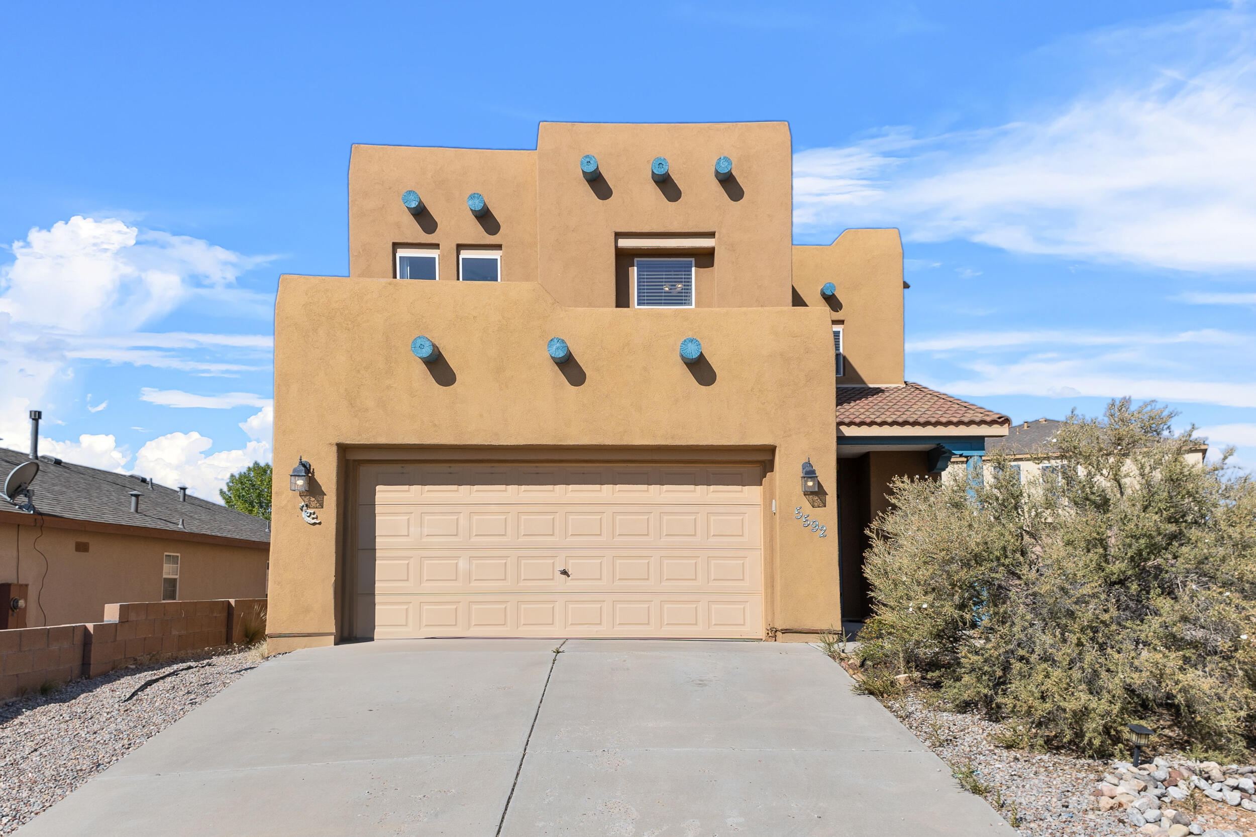 Nestled in the desirable Enchanted Hills, this charming Pueblo-style home offers 3 bedrooms, 3 baths, and a spacious two-story layout. Situated on a large corner lot, the property boasts backyard access and a two-car garage, providing ample space for parking and storage. The home's traditional architecture is complemented by its prime location, close to parks, shopping, and restaurants, offering convenience and a vibrant lifestyle. Whether you're hosting gatherings or simply enjoying the surrounding amenities, this home delivers both style and functionality in a sought-after neighborhood. Solar panels will convey and be paid off at time of closing.