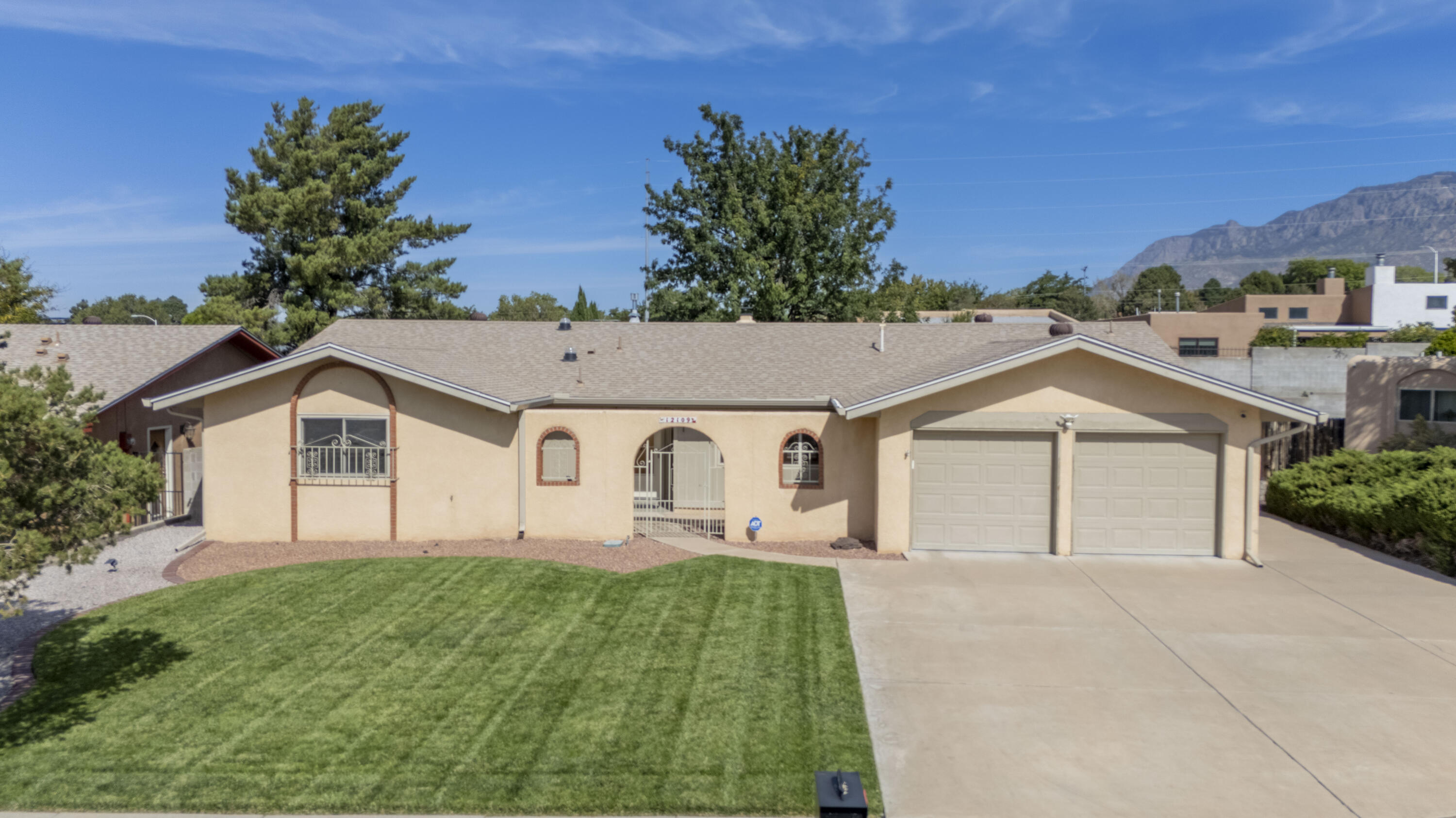 Inspiring updates and comfortable living come together in this 3 bedroom 2 bath home,nestled on a cul-de-sac lot. The kitchen unfolds w/granite counters,custom cabinets and a built-in hutch for extra storage.2 spacious living areas, 1 w/a cozy fireplace and mantle. A 3rd living area has an additional separate entrance and offers a versatile space-possible study, workout room; minor changes could make this a 4th bedroom, ideal for multigenerational living.Improvements include newer heating/Refrigerated air- 2 units, newer doors to exterior w/steel plated security, LED lights throughout, solar tubes adding natural light,and updates to bathrooms. Lush front & backyard with grass, covered patio and a storage shed.Finishced garage.Just minutes from trails in the foothills of the Sandias