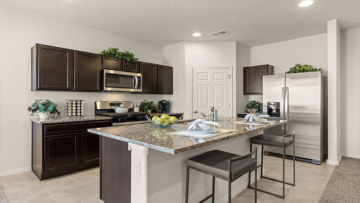 The Bella is a single story home offering 3 bedrooms and 2 baths. With an open concept layout, this home is perfect for entertaining or for a cozy night in! The kitchen features spacious granite countertops, Whirlpool(r) appliances, and walk in pantry. Smart home alarm system included.