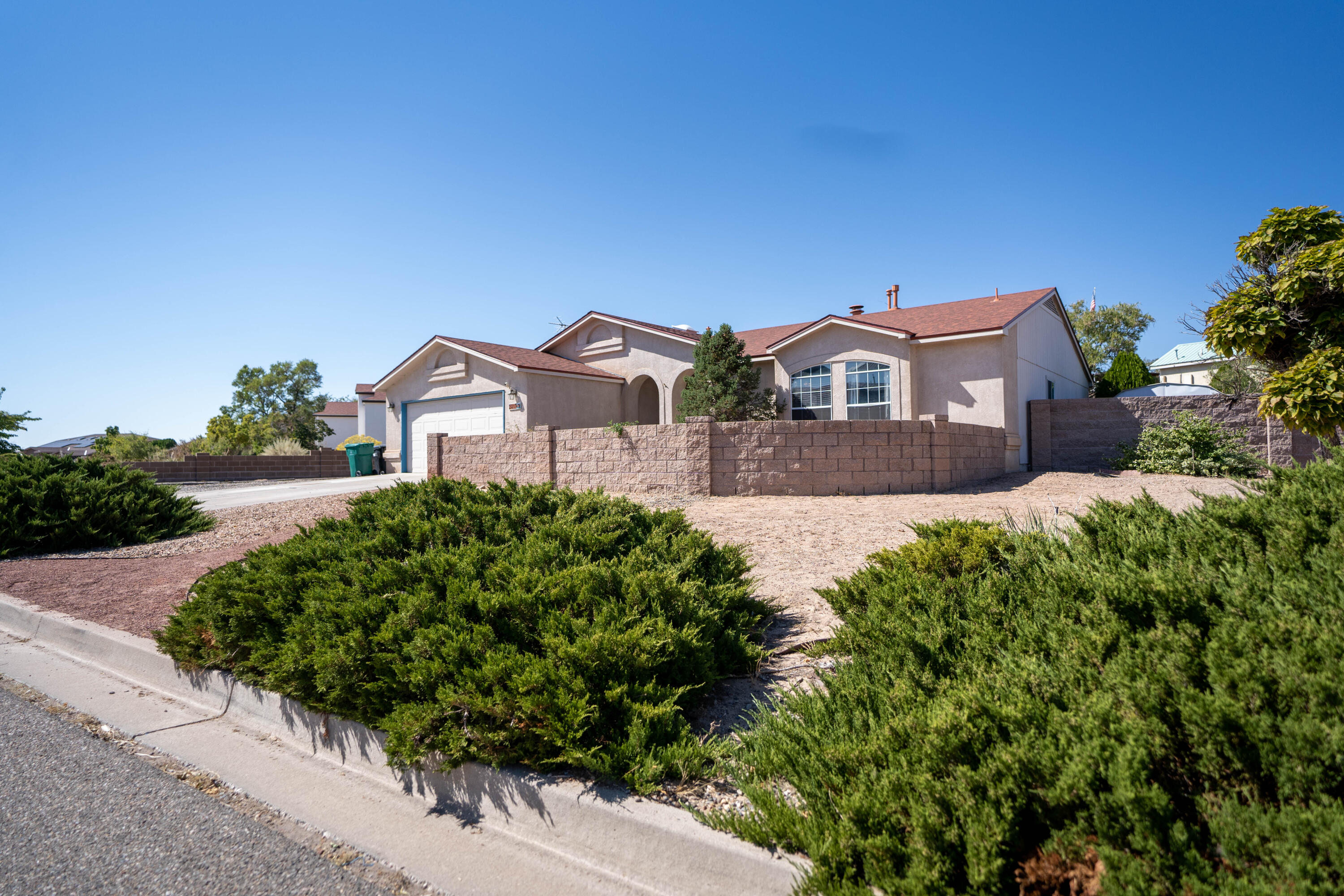 This beautiful Rio Rancho home is located in a prime location, offering both convenience and privacy. Situated close to all essential utilities such as groceries, schools, and shopping centers, this home provides the perfect balance between easy access to necessities and a peaceful residential setting. The house itself offers a unique and charming design, with a mix of Southwestern and modern influences. Inside, you'll find an open and airy floor plan, with large windows that flood the living spaces with natural light. The kitchen is equipped with modern appliances and great storage space. This Rio Rancho home is far from ordinary! come see for yourself!