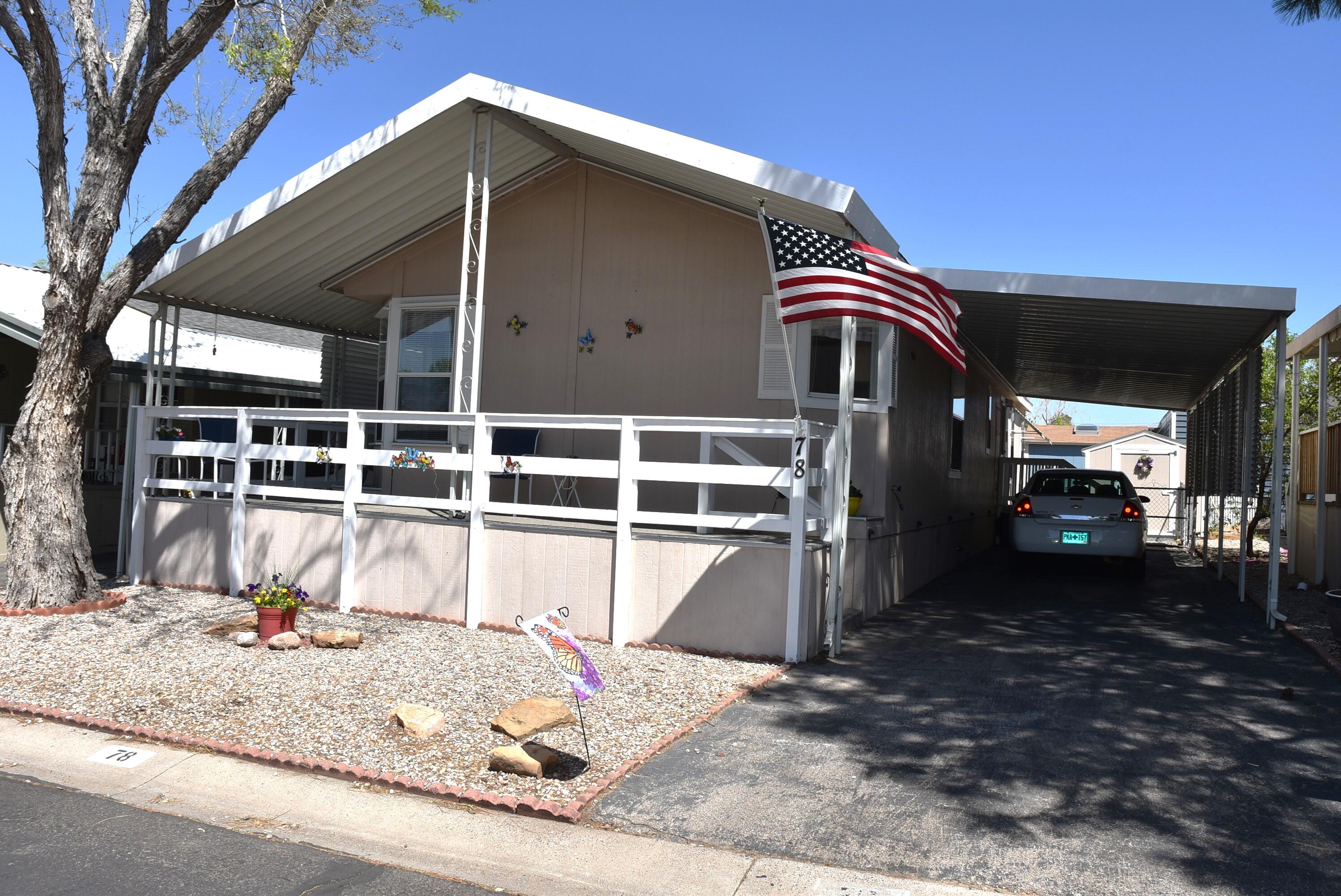 Like new, super clean comfortable home close to entrance of gated 55+ community. Easy access to clubhouse, freeway and shopping. This home has a brand new roof installed 4/24 and meticulously maintained. Refrigerated A/C keeps the home comfortable through out the summer season. Beautiful front wrap around porch with brand new carpet installed. Front kitchen and dining room layout, large living room and extra large master bedroom with walk in closet. All appliances convey with purchase. Good sized storage shed for those extra items. This is a 55+ active resort style adult Land lease community, pool, hot tub, game room, library, craft room, fitness center, pickleball, dining hall and much more. Call for your private showing today before this one is gone! Home only financing available.