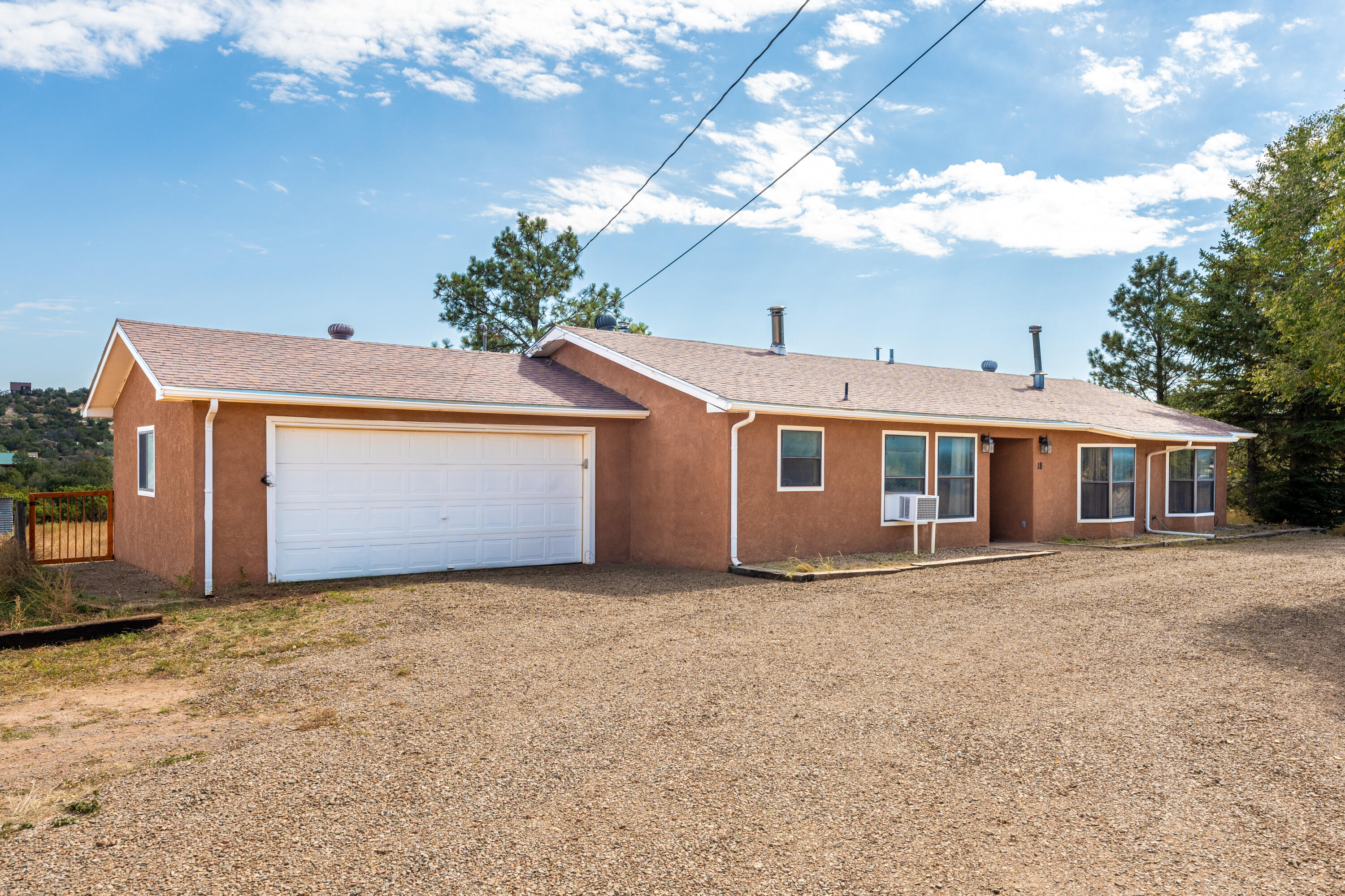 Seller is offering $4,000 in buyer credits!! This beautifully updated 3-bedroom, 2-bathroom home is ready for new owners! It features a spacious 2-car garage and ample space on 2 usable acres, which is fully fenced and gated. Inside, enjoy a bright living area that flows into a modern kitchen with updated appliances. The generously sized bedrooms offer comfort, and the two bathrooms provide convenience for all. The highlight is the huge basement, ideal for a recreation room, gym, or extra storage. The outdoor space is perfect for gardening, entertaining, or simply enjoying nature. Don't miss this opportunity to own a wonderful home with both comfort and room to grow!