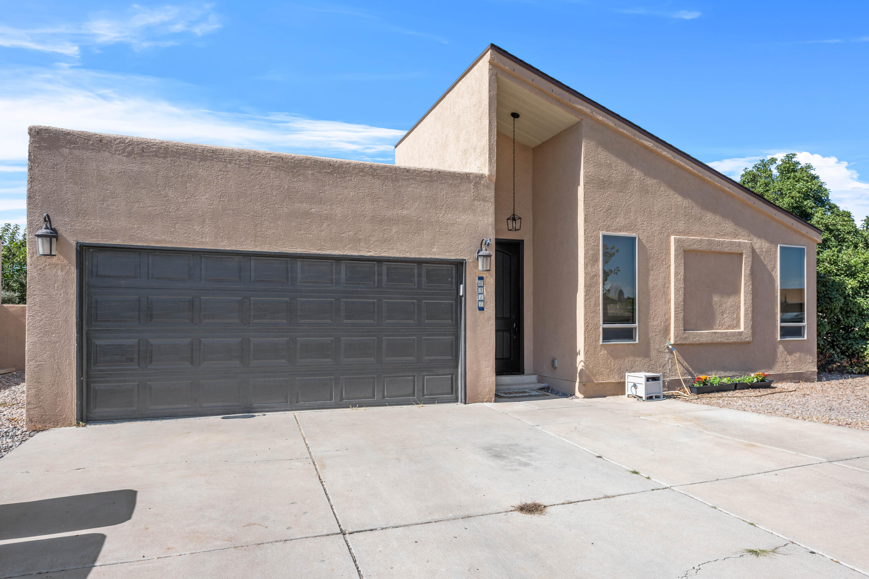 Welcome to your move-in ready oasis in the desirable Taylor Ranch neighborhood! This charming corner lot home features 3 spacious bedrooms and 2 beautifully updated bathrooms, tons of natural light, freshly painted walls and newer flooring throughout. The large living space boasts high ceilings and open concept kitchen/living/dining. The updated kitchen shines with sleek quartz countertops, perfect for both cooking and entertaining. Enjoy the luxurious quartz finishes in the bathrooms as well. Step outside to a lovely yard that offers both privacy and space (including backyard access). Conveniently located near Mariposa Park, this home is ideal for families and outdoor enthusiasts. Don't miss the chance to make this gem your own! Schedule a showing today!