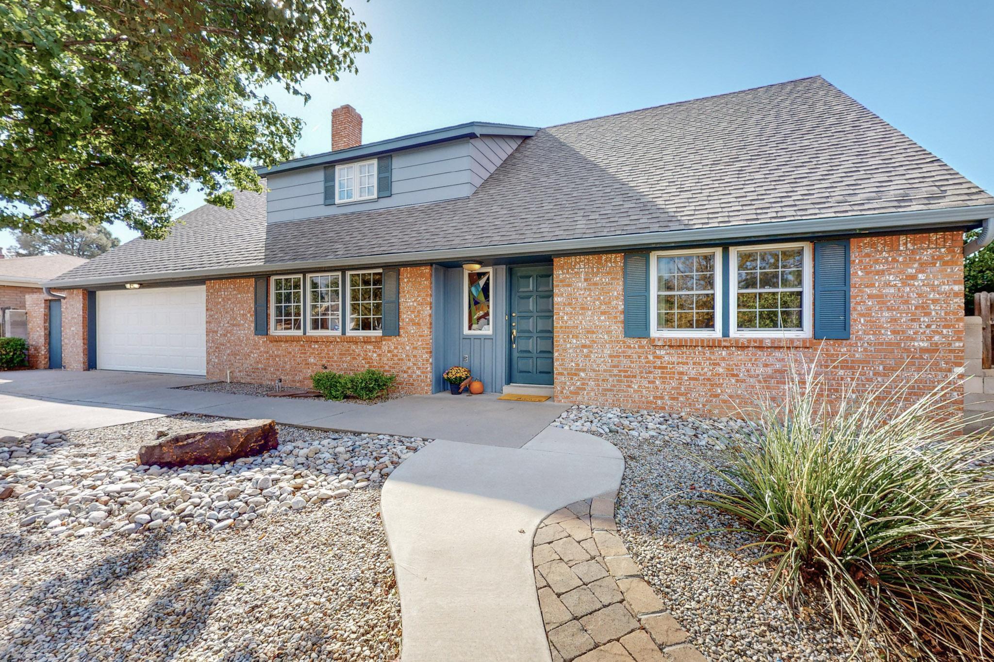 OPPERTUNITY KNOCKING IN ABQ NE HEIGHTS - COME SEE THIS BEAUTY ASAP! Meticulous 5 BDR, 3 BATH home w/easy commute to Sandia National Laboratories & Kirtland Air Force Base. Charming curb appeal welcomes you from the moment you pull up. Spacious floor plan offers multigenerational living w/2 living areas, 1 BDR downstairs & 4 more generous BDR upstairs. Plenty of room for your home office or to homeschool. Custom designed kitchen w/stunning cabinetry & built-in desk in nook area. Tons of storage throughout the home including walk-in closets & a dedicated storage room upstairs. Low maintenance & professionally landscaped both front & back. Private backyard oasis w/Zen-garden feel highlighted by serene walkways & two covered patios to relax under. Close to foothills for hiking & biking too!