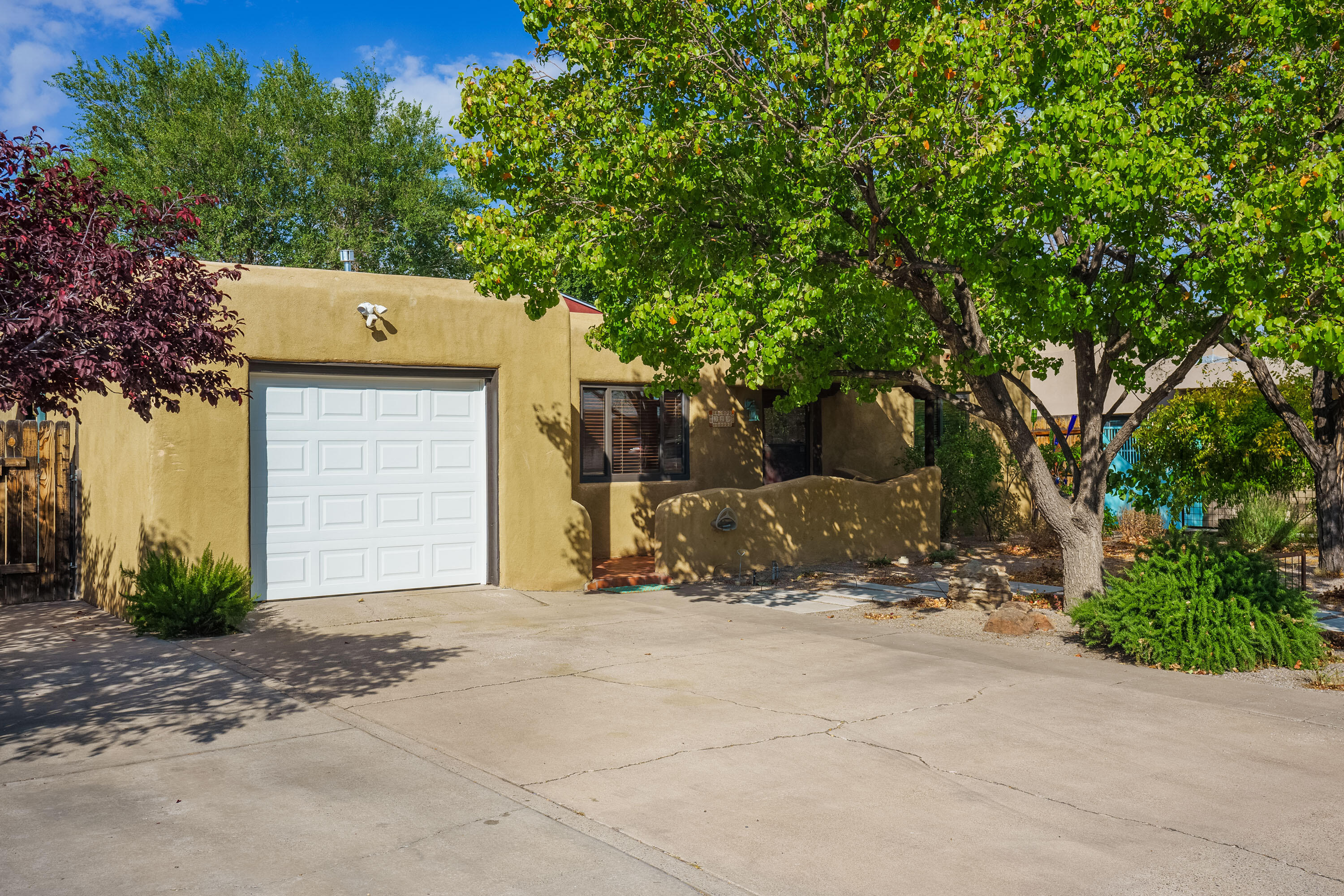 A fantastic opportunity to buy in Nob Hill, one of Albuquerque's most vibrant neighborhoods! Deep charm and character abound in this classic midcentury pueblo home. The natural light is warm and wonderful on the hardwood floors and custom colors. Solid updates; windows, kitchen and hall bath. There has been a nice addition with a large living room with French doors to the covered patio and a big, modern, primary suite with vaulted ceilings featuring direct access the backyard which is AMAZING! Mature plantings, brick path/patio, a nice big tree and garden storage. Its your own botanical garden, and one of the best parts of the property. Just a short distance to all the shopping and amenities of Nob Hill, UNM, the base, public transport with a walk score @ 72 and bike score of 98!! Thanks!