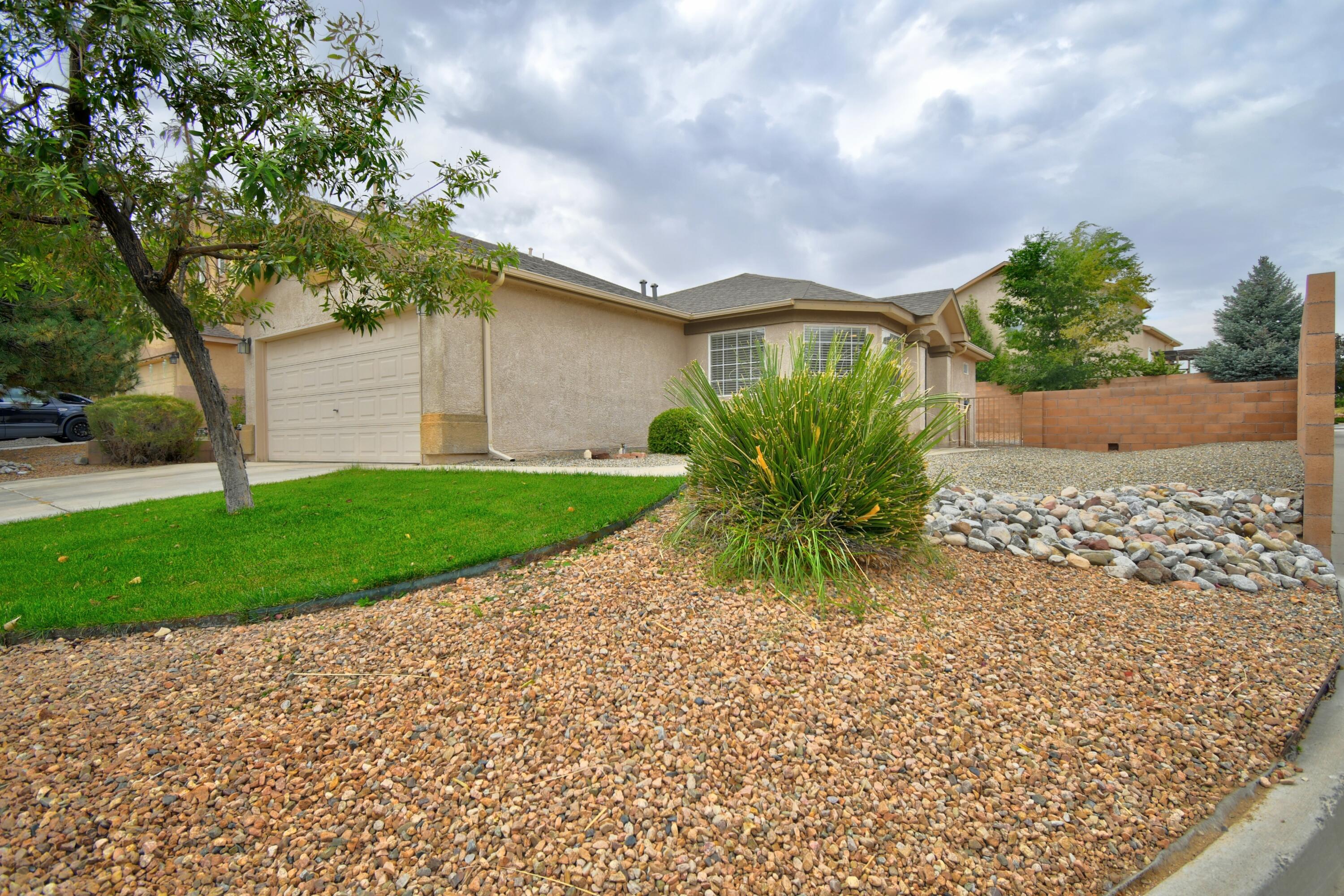 Welcome to your dream home, nestled in the highly sought-after Ventana Ranch! This stunning single-story gem boasts 3 spacious bedrooms, 2 full baths, and a 2-car garage. Situated on a desirable corner lot, it offers the perfect balance of privacy and space. Recent upgrades include stylish tile flooring in the kitchen and dining areas, fresh carpet, and a newer roof for peace of mind. With ceiling fans, a walk-in closet, elevated block walls, and the comfort of refrigerated air, this home is move-in ready. Located near Tony Hillerman Middle School and Volcano Vista, it also qualifies for FHA first-time buyer financing. Priced to sell, this beauty won't last long--schedule your showing today!