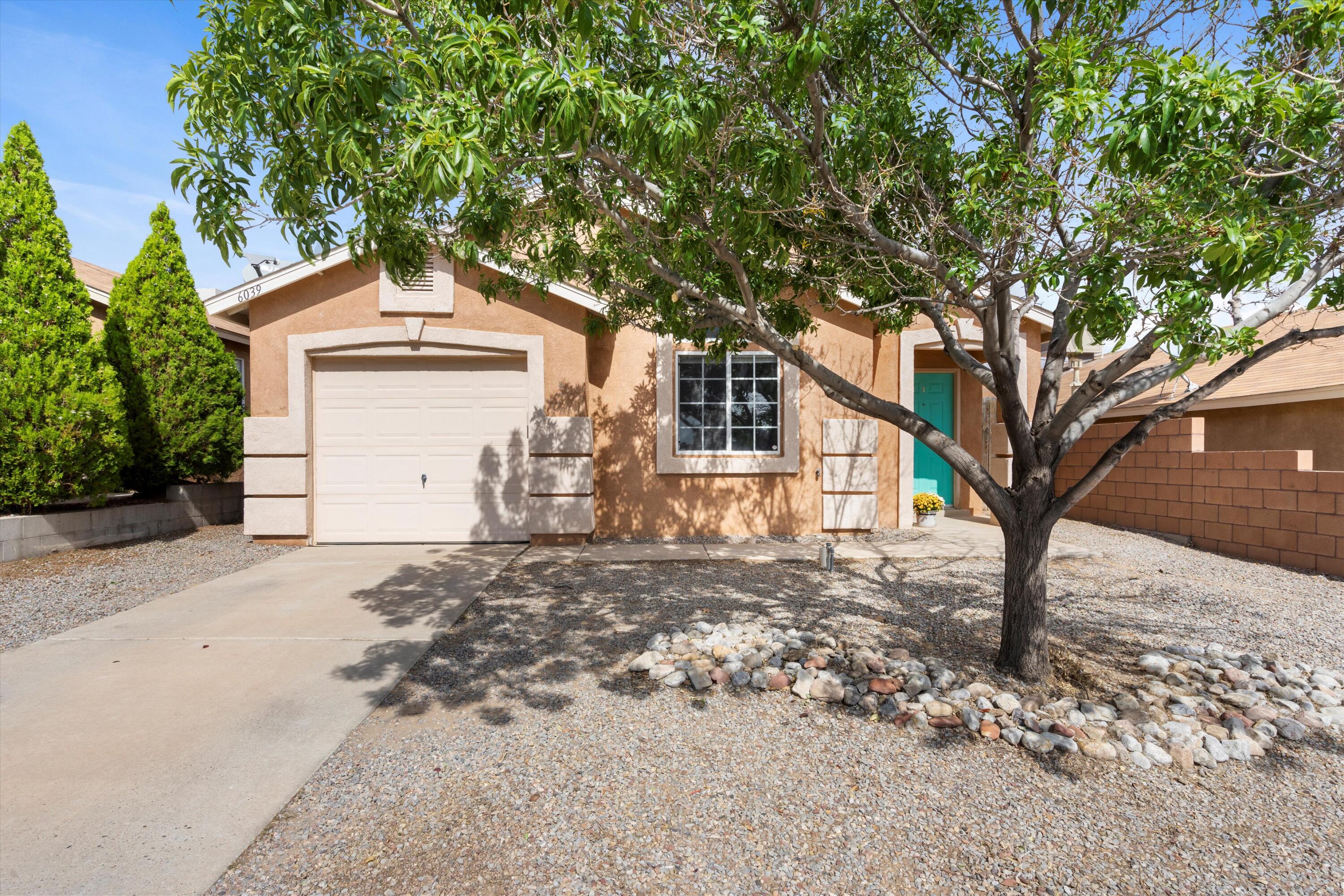 MOVE ON IN right now to this lovely 2 bed, 2 bath home. Be greeted each day by a picturesque entrance with a large shade tree, and step into your gorgeously styled home. The soft gray color palette and elegant wood-look vinyl flooring offer a sleek, contemporary ambiance throughout.The open floor plan showcases vaulted ceilings, a custom-designed fireplace, Sliding glass doors in the kitchen and master bedroom lead to a private backyard with a spot of mountains for your viewing pleasure. The backyard features a walled perimeter for privacy and an open patio ideal for outdoor living. Situated in the booming Westside area, this home is conveniently located near Rust Medical Center, breweries, restaurants, shopping, and a nearby movie theater. Don't miss out on this lovely find!