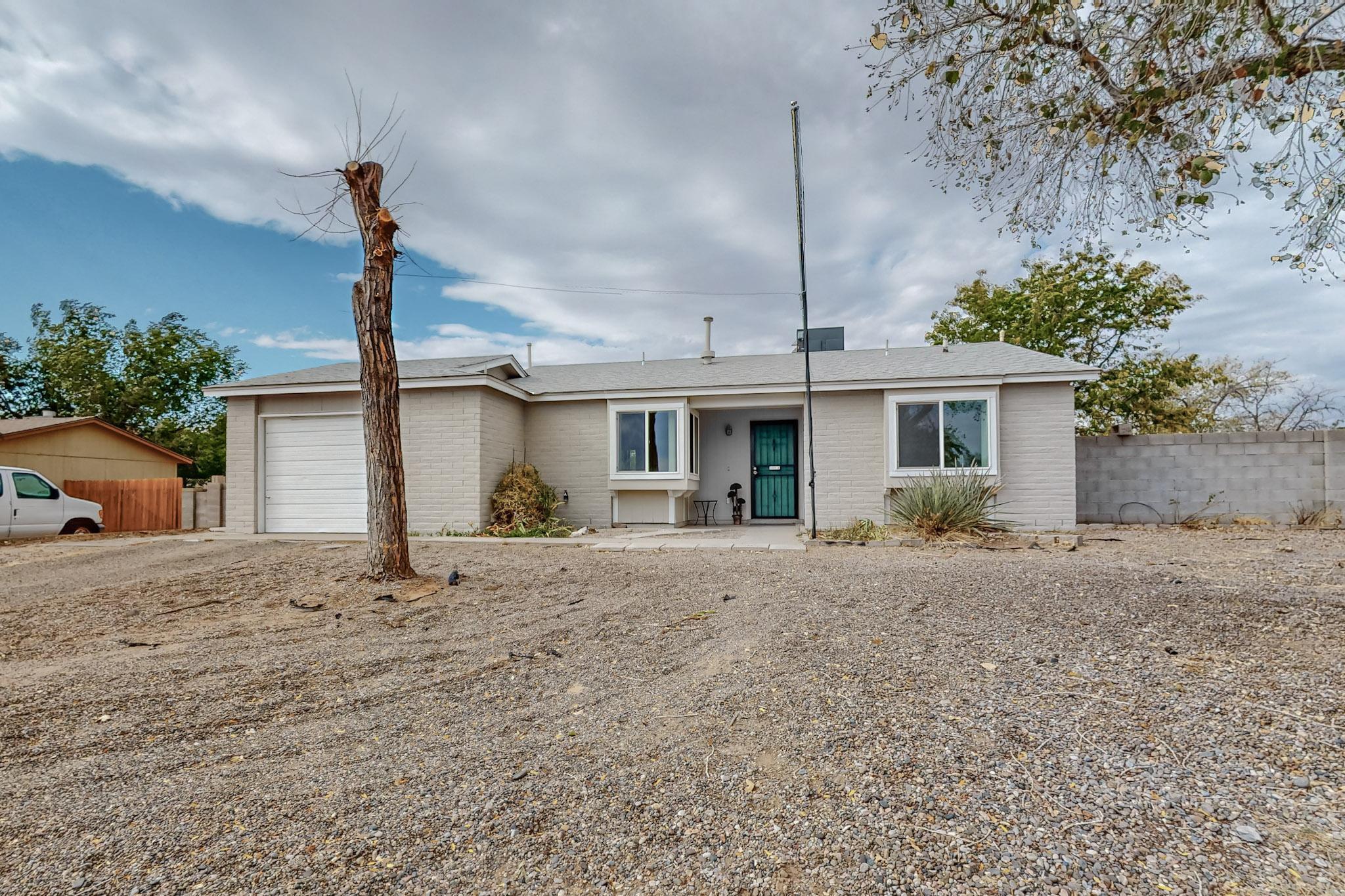 PRICE IMPROVEMENT!!!  This beautifully updated 2-bedroom, 1-bath home in Rio Rancho features a spacious open floor plan with a newly renovated kitchen, living, and dining area. The kitchen boasts stunning quartz countertops, while new flooring throughout the home adds a modern touch. Recent upgrades include a new roof, new plumbing, and a brand-new combo heating and cooling unit, ensuring comfort and peace of mind. Nestled on a large lot, the outdoor space offers endless possibilities. Conveniently located near schools, shopping, and parks, this home is perfect for first-time buyers or those looking to downsize and enjoy modern comforts in a prime Rio Rancho location.