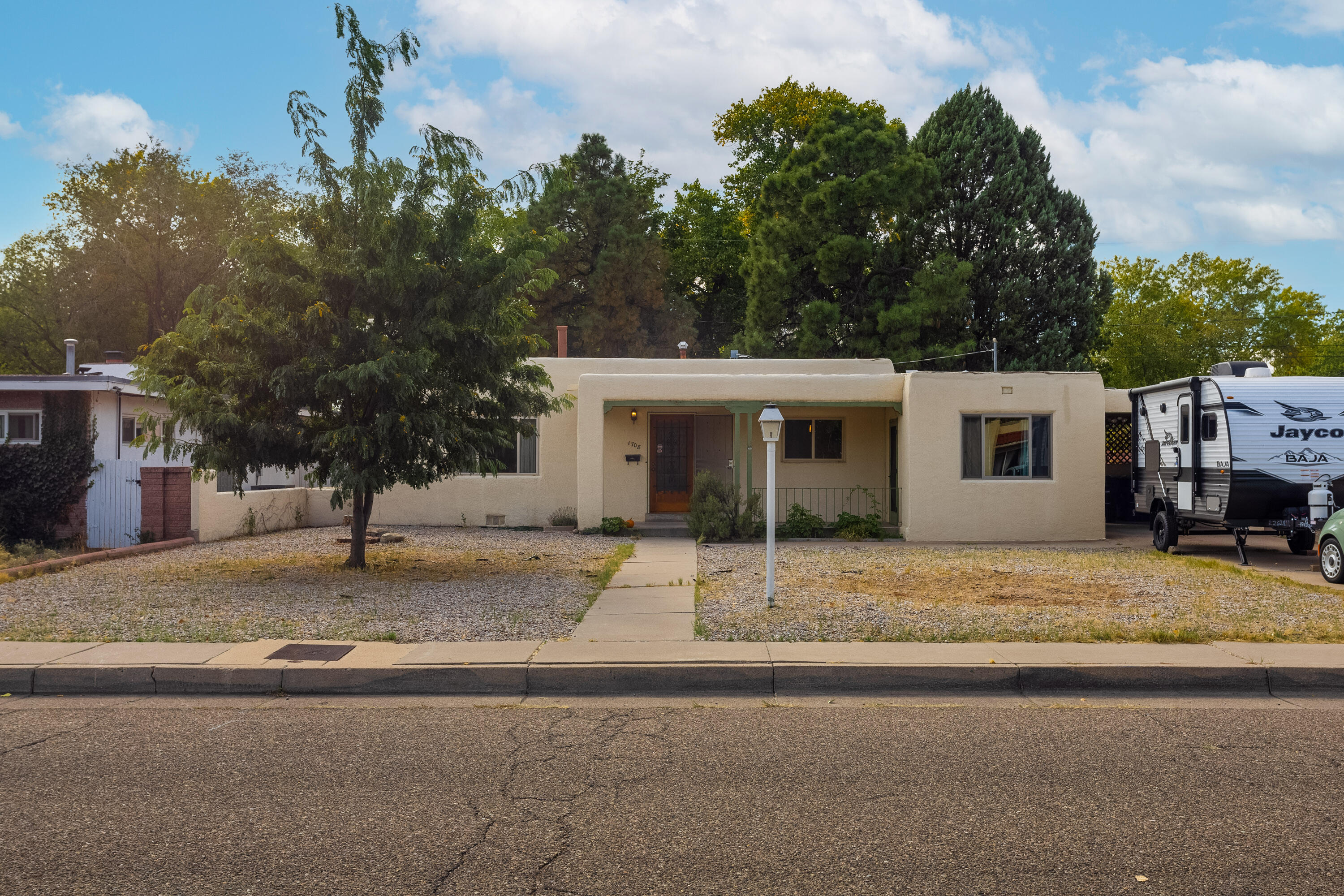 Location! Location! Location! Just steps from the Albuquerque Country Club & Kit Carson Park, Go for a morning walk around Tingley Beach & bike riding on The Bosque. Close to some of Albuquerque's best restaurants. Spend the day at the ABQ Bio Park or take a walk to the Sawmill Market. You've got to see this one. Great for an at home office. Plenty of closets space for you needs. Enclosed car port. The driveway is long enough to park your RV or camper.