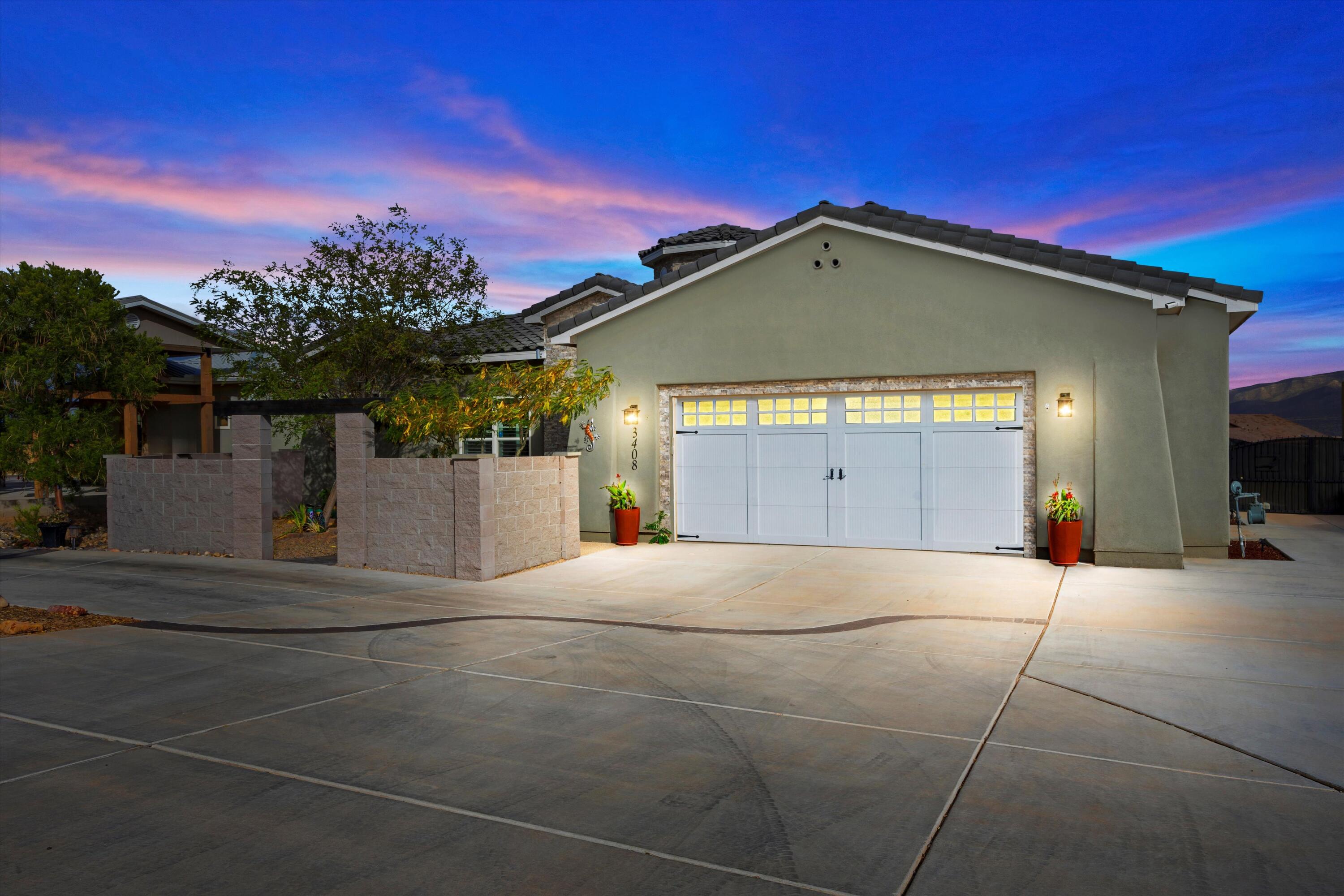 THIS IS A SHOWCASE HOME! For those who love to entertain, this one dazzles inside and out! Upscale design matched by breathtaking views.  Grand circular driveway and courtyard welcome you. Impressive 20-ft tall foyer, and captivating lighting, custom cabinetry, dedicated office, and beautiful flooring throughout accented by 10-ft ceilings and 8-ft doors. Rock star kitchen features double ovens, cozy breakfast nook, and a 4-seater island. Relax in your spacious living area with custom fireplace and built-in bookshelves, or escape to the XL master with sitting area, soaking tub, and enormous walk-in! There is even a dog-wash! Backyard is an entertainer's dream, with custom bar, shaded seating, and XL storage/man cave. Enjoy your next chapter grilling, lounging, or hosting the perfect party.