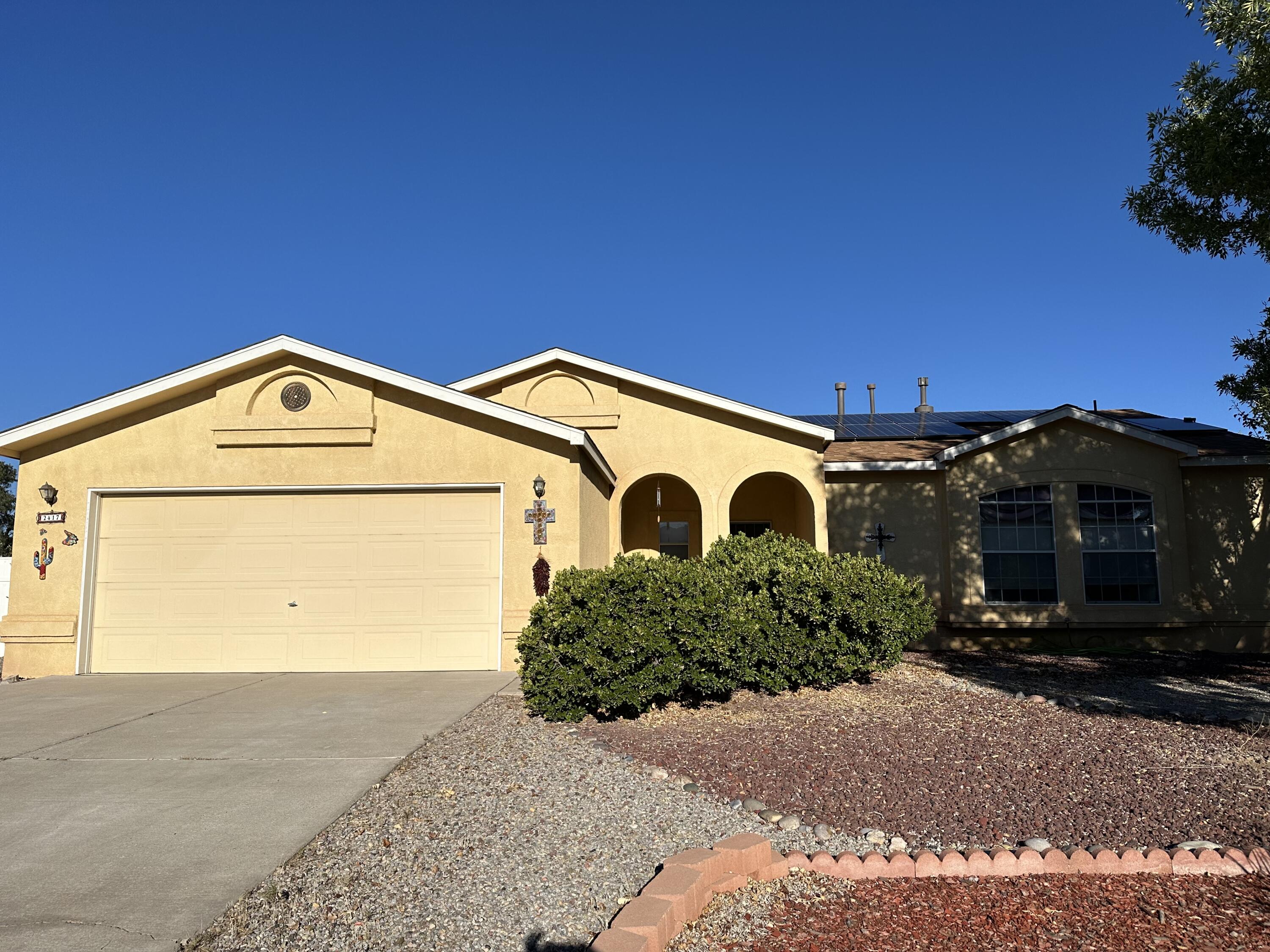 Charming home with beautiful mountain views in River's Edge with modern upgrades throughout! Enjoy purified water with a reverse osmosis system, new eco-friendly toilets, a re-tiled gas fireplace, and an AMAZING central HVAC system! The backyard boasts a new pergola, shed, and privacy fence, plus an extended cedar block fence for added seclusion. Solar panels, central heating/AC, updated pipes (2020), and a new roof (2021) ensure efficiency and comfort. Features custom barn closet doors, built-in bookshelves, copper fixtures, and stylish steel ceiling fans. Kitchen includes  a full matching set of a gas stove with a convection air fry oven, an amazing dishwasher, and an upgraded refrigerator and microwave. Come look at your new home!