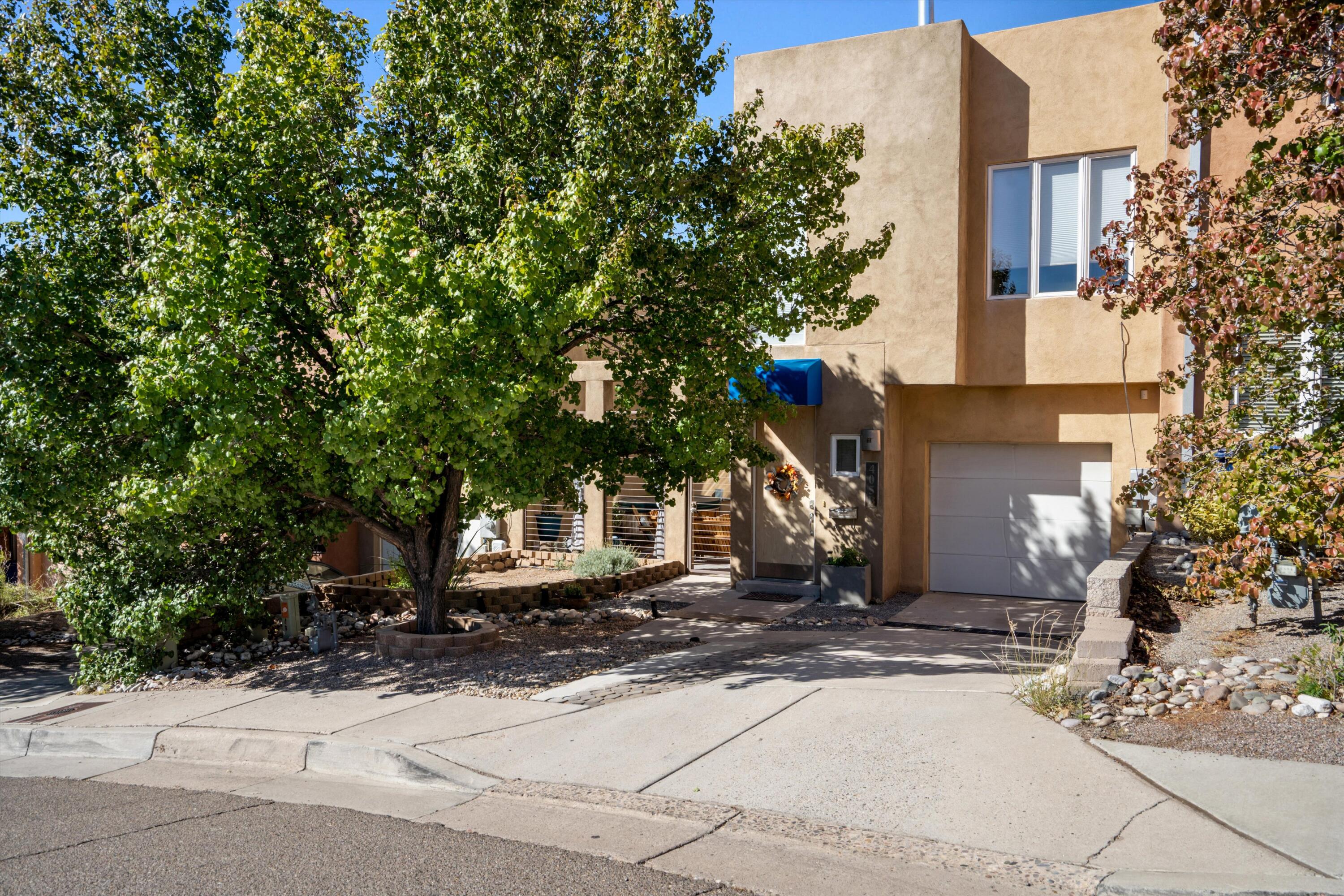 Stunning townhome in Spruce Park. 3 spacious bedrooms and 2 full baths. UNM, Hospitals, Nob Hill are just minutes away. Enjoy city views from the upstairs patio, a soak in the hot tub in the courtyard, or the serene landscape in the backyard. The open and bright floorpan is sure to impress! Recent updates include a New Roof, New HVAC and flooring.