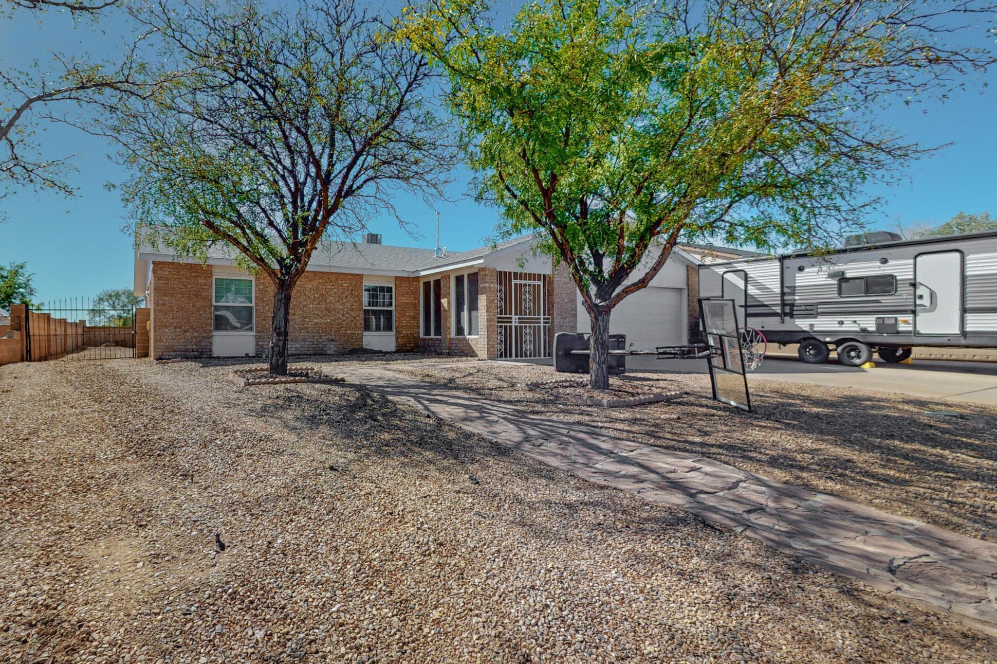 Immaculate property located in a desirable and looked after area in Rio Rancho. This property has easy access to main roads and highways and is near all amenities for your convenience. Fall in love with the chef's dream kitchen with all new cabinetry, granite countertops, modern laminate flooring and stainless steel appliances. New and upgraded refrigerated air system was installed last year and roof was replaced in 2018 with years of life to come. Enjoy the beautiful mountain views from your back patio or relax in the large sunroom which is a bonus and not included in the home's square footage. This property has backyard vehicle access and it comes with a bonus shed for all your storage needs. Call your favorite Realtor to schedule a showing today