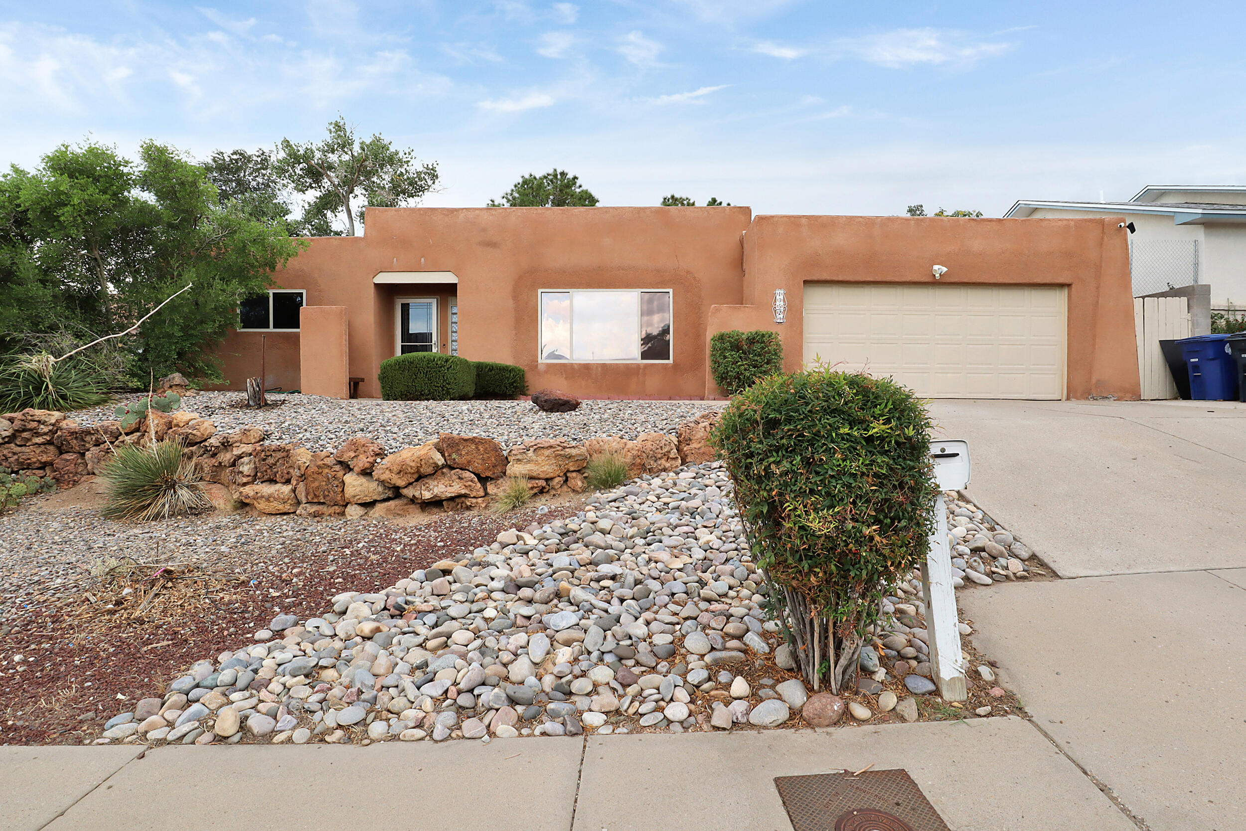 Welcome to 13529 Durant, a stunning residence nestled in the picturesque foothills of Albuquerque, NM, where breathtaking mountain views await you! The seller is offering a generous $5,000 credit at closing toward new carpet and appliances with an acceptable offer, making it easier for you to customize your new home. This freshly painted gem features 3 spacious bedrooms, including a master suite that is thoughtfully separated from the other rooms, providing privacy and tranquility. With 2 modern bathrooms, this home offers the perfect blend of comfort and style for families or anyone seeking extra space.