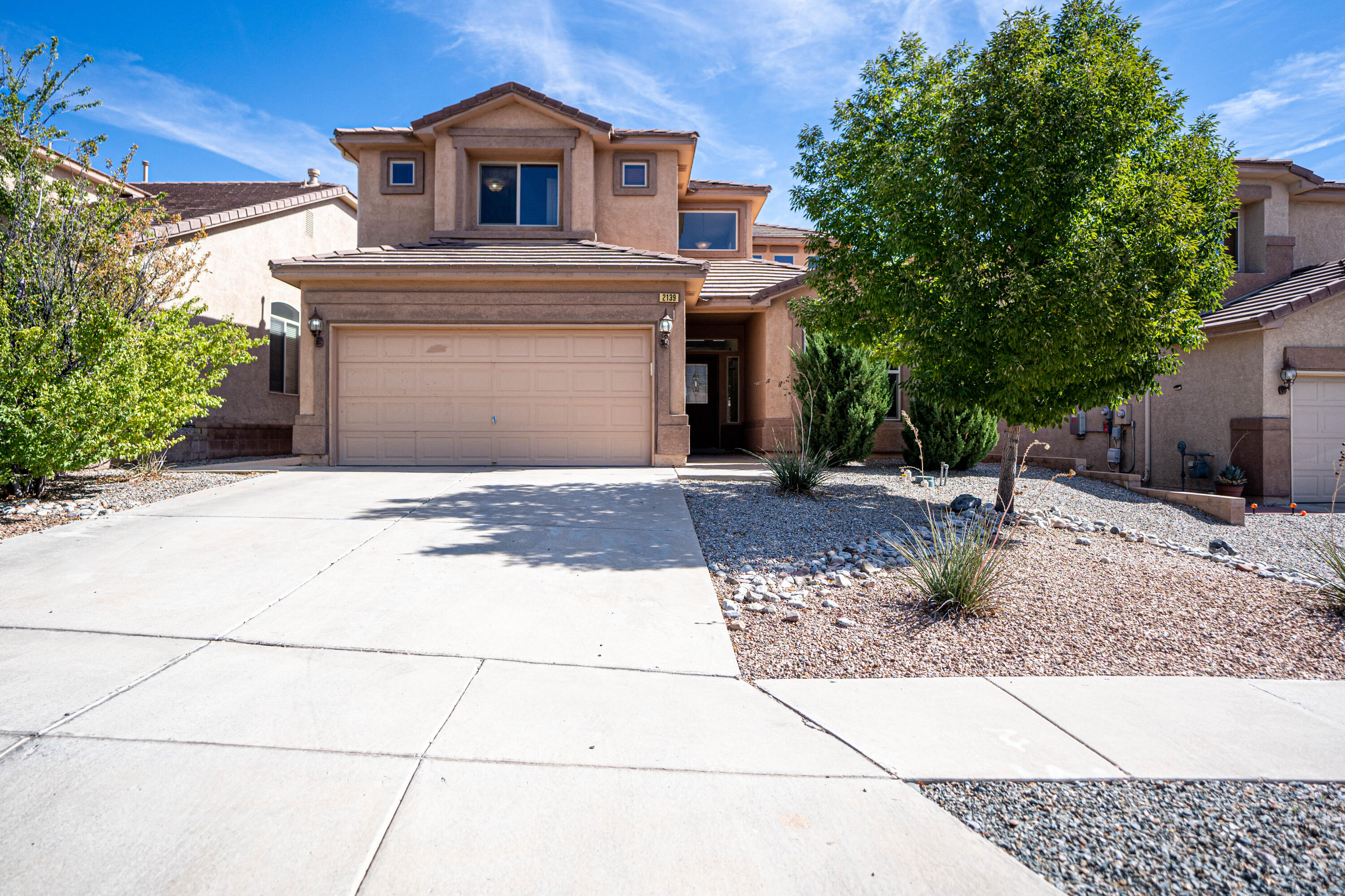 Discover this inviting 2-story home in Cabezon, thoughtfully crafted for comfort and convenience. With a versatile loft, a main-level primary bedroom, and walk-in closets in each bedroom, this home provides both functionality and style. Soaring ceilings enhance the sense of space, while the cozy fireplace serves as a welcoming focal point in the living area. Smart switches in the primary, living room, and loft, add modern convenience throughout. Step outside to enjoy a covered patio with a gazebo and ceiling fan--perfect for entertaining or relaxing evenings. The outdoor space also includes water fountains, lending a serene touch to the setting. Located near community parks, this home is ideal for families and individuals alike. Don't miss the opportunity to make this beautiful home yours!