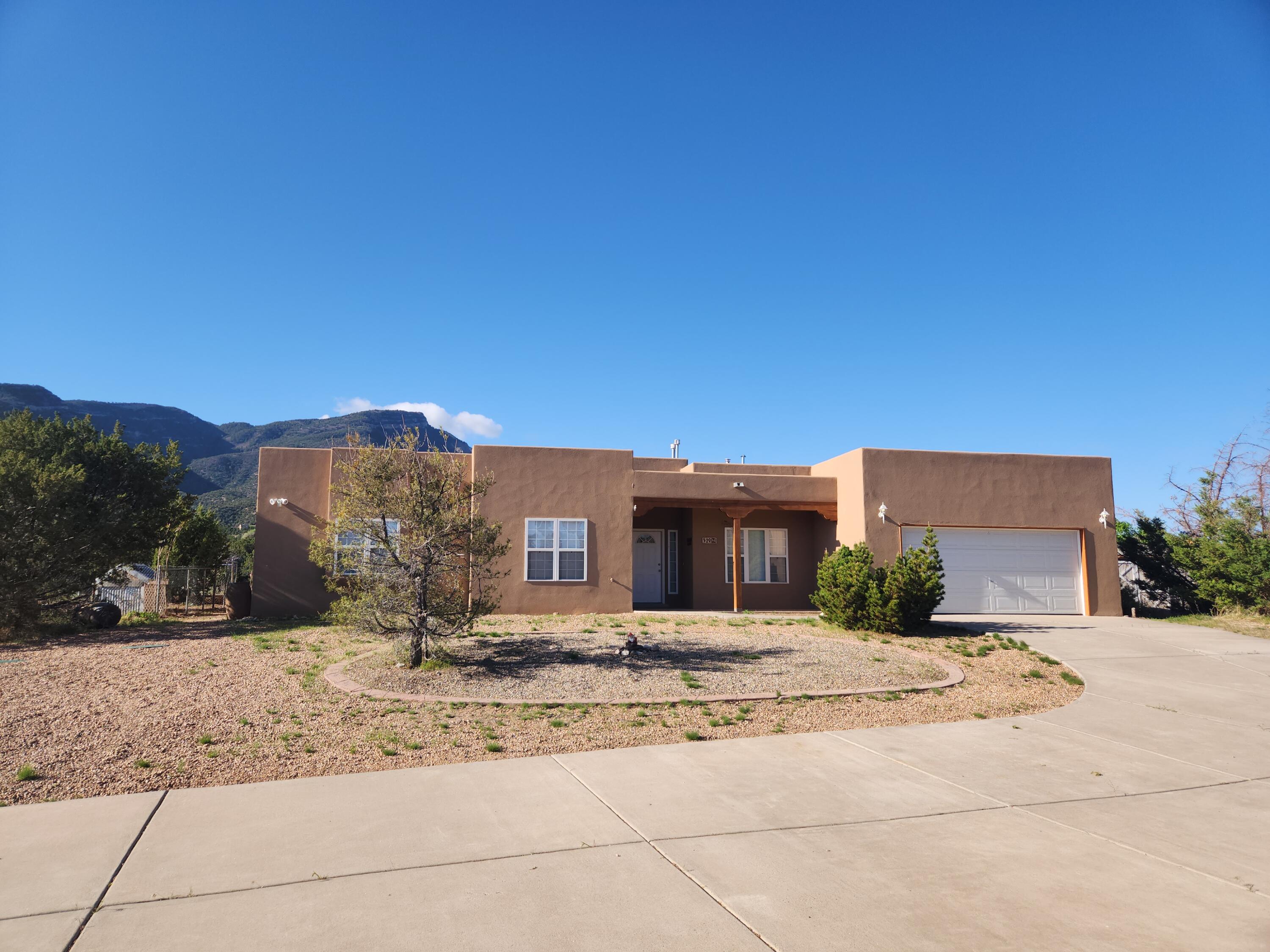 3 BDRM + OFFICE WITH HUGE WORKSHOP/GARAGE! $595,000. Quiet location, convenient to Highway 165, this 3 bedroom + office is move-in ready! New kitchen appliances and new tile & carpet! Single level 2,315 sq ft home, with Sandia views from living, dining, breakfast nook, kitchen & primary bedroom. Southwest style home with (attached) 2 car garage PLUS 971 sq ft (detached) workshop/3 car garage - great for artists, car enthusiasts, extra storage, etc! Comfortable floor plan with office (and half bath) just off the front entry. Primary bedroom has walk-in closet. Skylights give this home wonderful natural light! Gas log fireplace in the spacious living room and pellet stove in dining. Brand new septic tank. Less than a 1/2 mile from Hwy 165 & only a 20 minute drive to Albuquerque! No HOA!