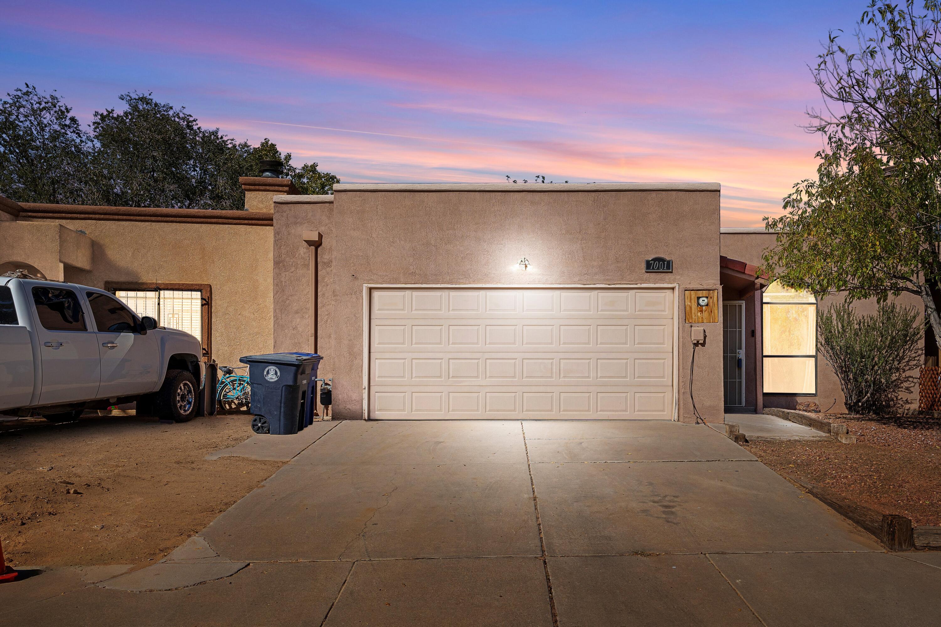 Welcome to this beautifully updated 3-bedroom, 2-bathroom townhome in Albuquerque's Ladera Heights! With a brand-new roof backed by a 10-year warranty, this home offers peace of mind and style. Enjoy a modern, refreshed interior featuring an upgraded kitchen with sleek finishes, renovated bathrooms, and many updates throughout. The spacious layout provides ample room for family living, while the two-car garage adds convenience and extra storage. Situated close to parks, shopping, and schools, this move-in-ready townhome blends comfort and location. Don't miss your chance to make this inviting, upgraded space your new home!