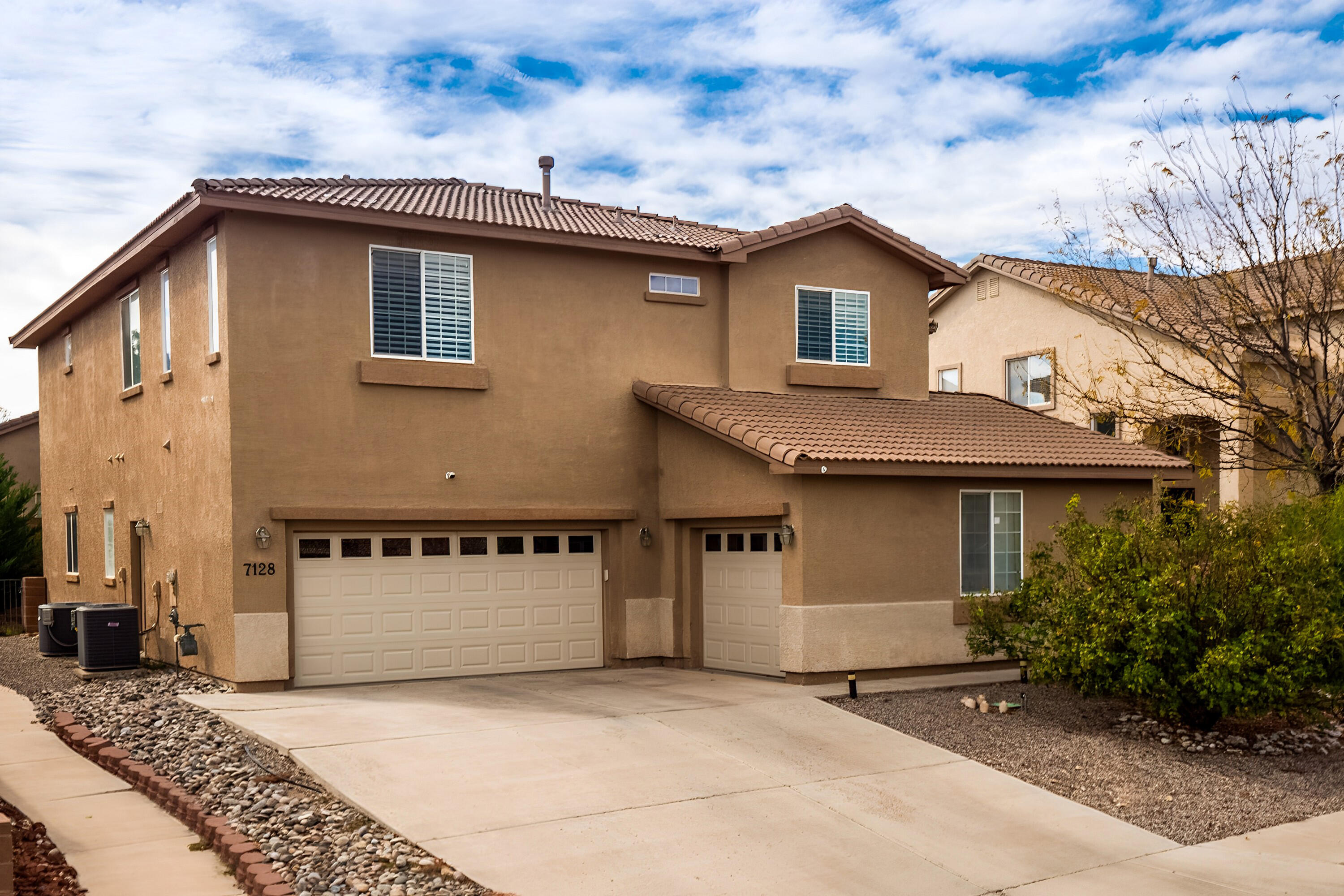 SPACE and more SPACE and more SPACE~This is a LARGE HOME and needs a family TODAY~Primary suite can fit any sized furniture PLUS PLUS PLUS~Large walk-in shower w dual heads plus a separate soaking tub~ENSUITE downstairs if needed~Oh yeah, and there are FANTASTIC views of the Sandia Mountains from the upstairs Primary Suite Balcony~This OVERSIZED home does need a little bit of basic TLC but it is definitely a GREAT BUY~COME SEE TODAY!! Seller will contribute $5,000 + towards buyers closing costs.