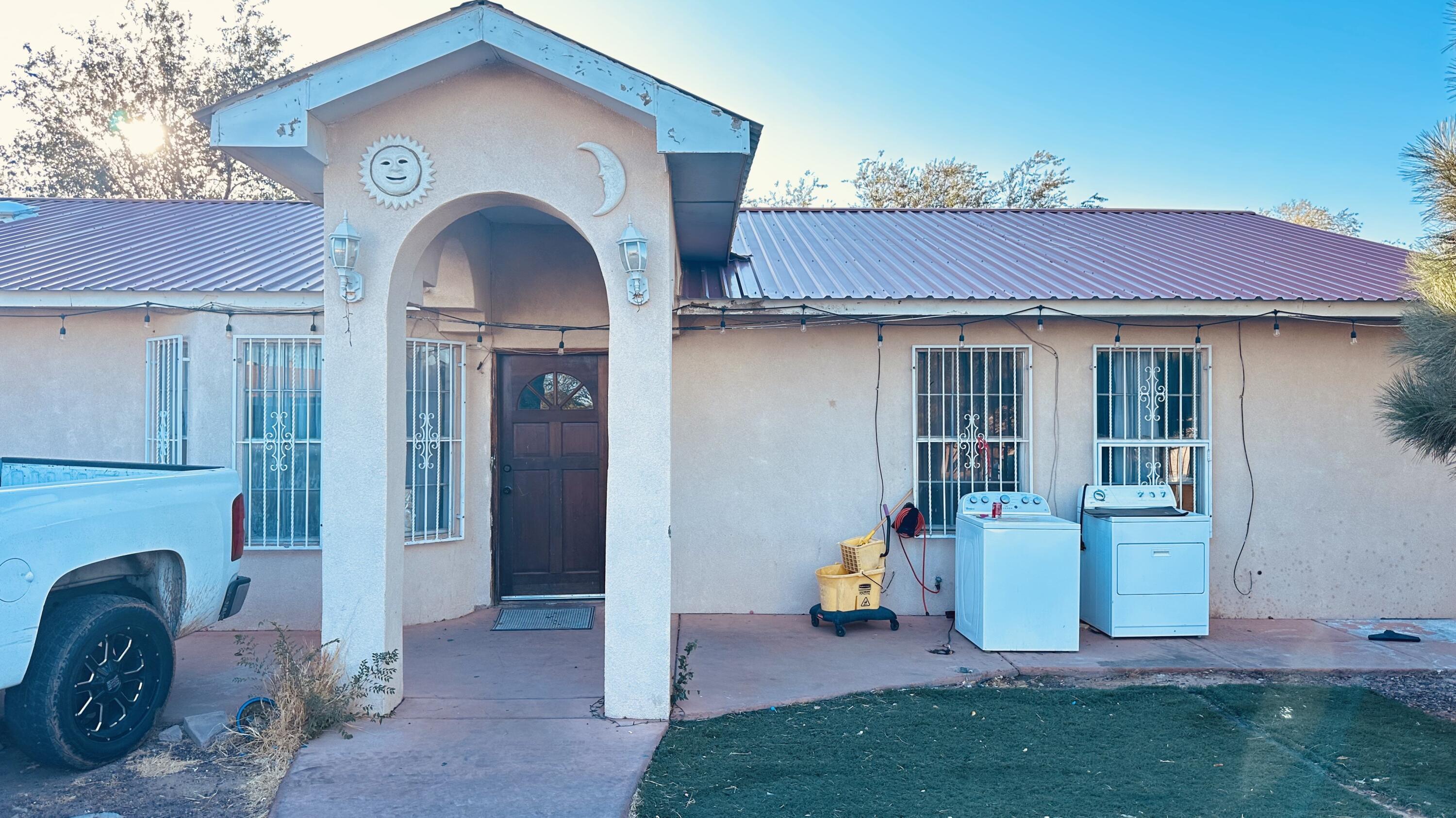 Good size corner lot with back yard access,   metal roof and refrigerated air.   A large storage building is located in the south west corner of the property with endless possibilities for conversions.  A little love and updates can make this house your perfect home.