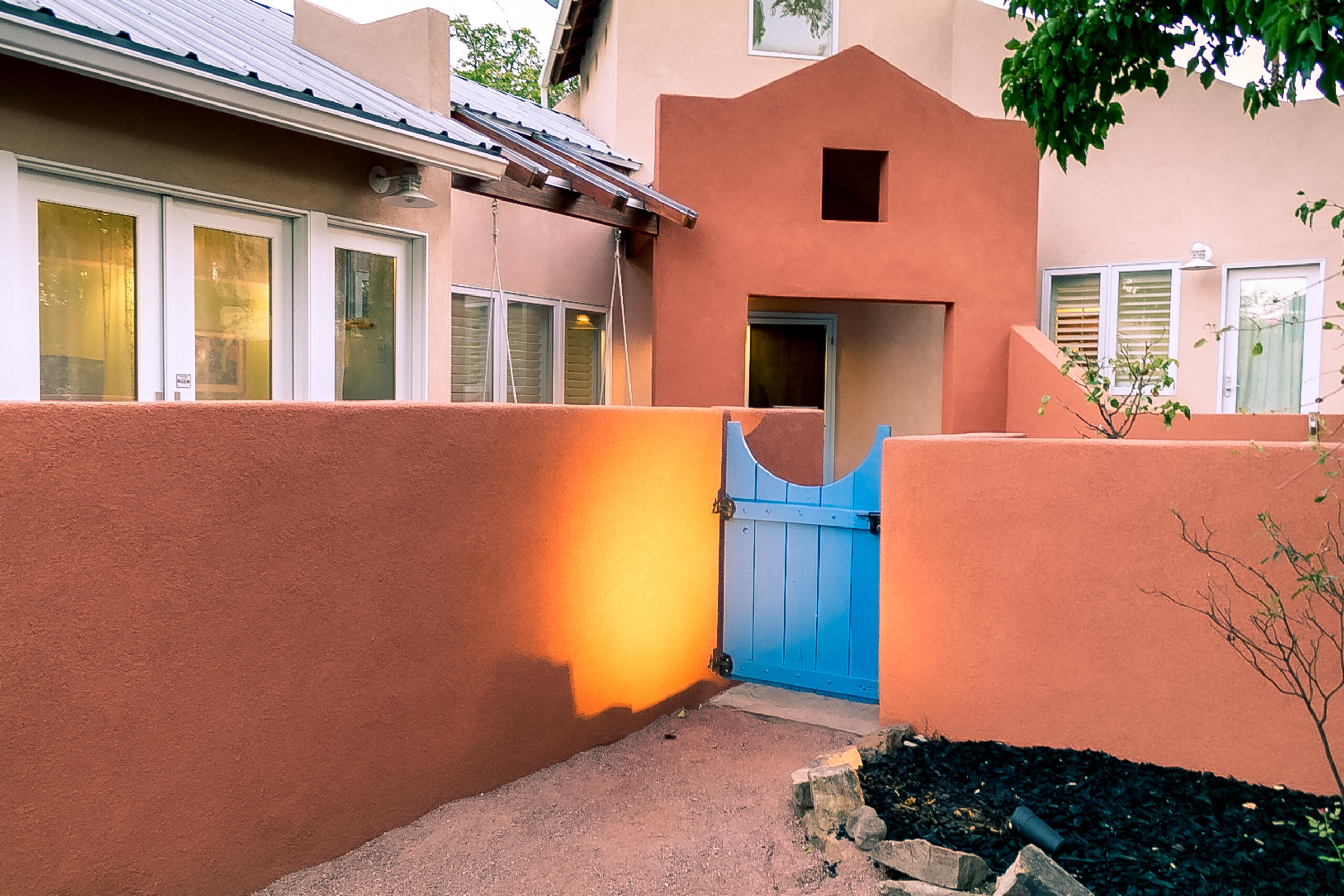 One of the most distinctive homes along Campus Boulevard in Nob Hill/Monte Vista! Thoroughly unique in its architectural execution, this one-level home was once described as ''gleefully bohemian'' with its Venetian diamond plaster walls awash in color + the merging of Asian & contemporary design elements. Open-concept kitchen with vintage Chambers gas range/oven + classic GE fridge. Two gas heat stoves for warmth & ambience. Refinished bamboo flooring. Plantation shutters. Marble accents. Skylights + vaulted & cathedral ceilings of varying heights create a light & airy environment. Eagle double-pane thermal windows & French doors. Front courtyard + several patios; xeriscape front & back. Gas CFA new in 2023. Two water heaters. One car garage.