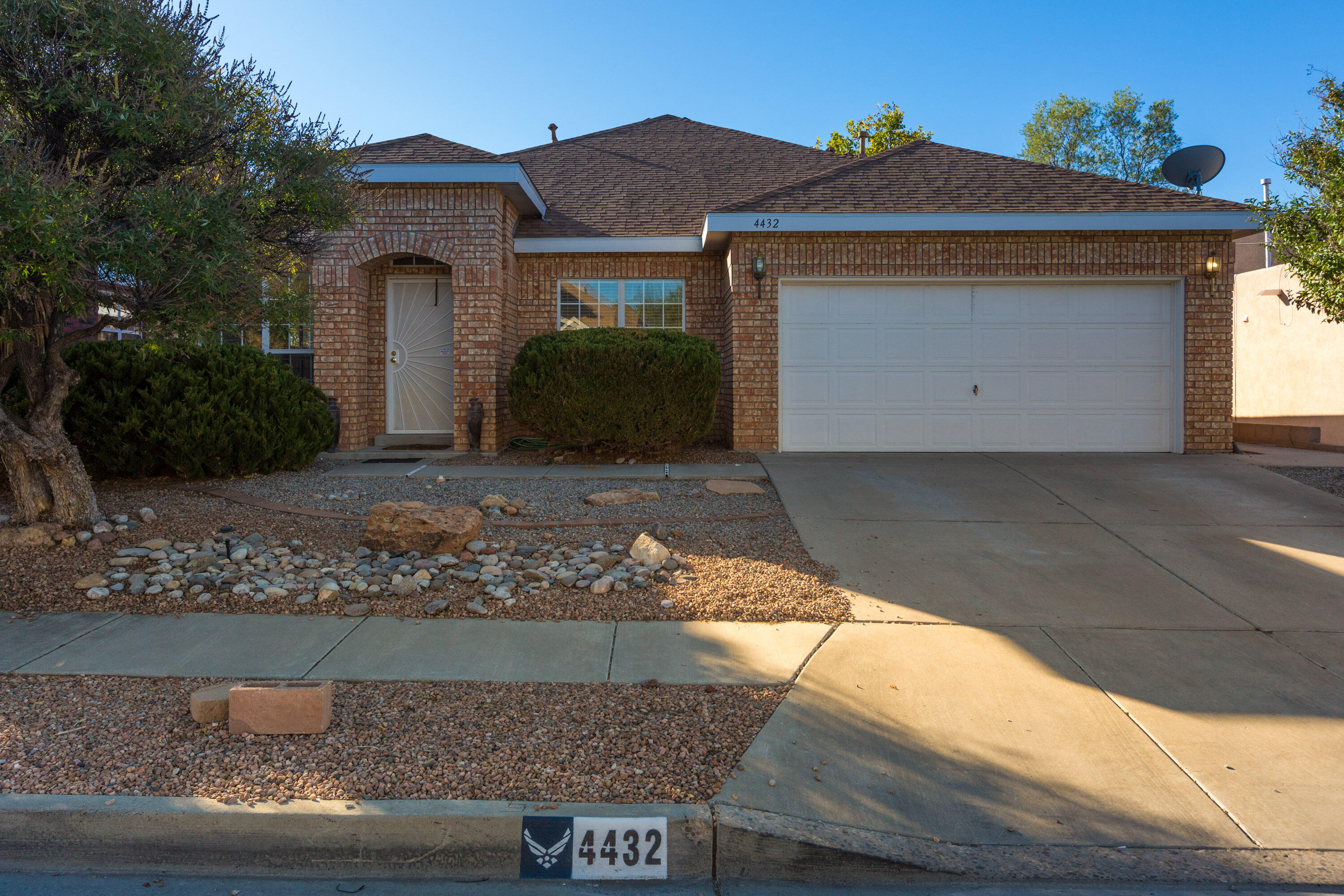 This delightful brick home boasts 4 bedrooms, 2 full bathrooms with living area and dining area combined. Enjoy the open kitchen with island and breakfast nook, comfortably near the warm gas log fireplace in family room, perfect for cozy evenings. The primary bedroom provides seamless access to the backyard and covered patio, while the property is ideally situated within close proximity to shopping and dining options. Enjoy the newly installed flooring, toilets, and evaporated cooler. Roof replaced in 2017.  Take pleasure in the spacious backyard and a large storage shed that conveys. This charming property harmoniously combines comfort and convenience all on a single level, making it an ideal haven for its new owners.