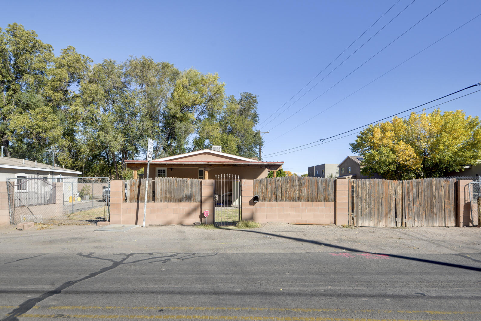 Affordable South Valley Double Wide on permanent foundation.  Large corner lot close to river, Tingley Beach, BioPark, Zoo and downtown.  Generous sized bedrooms!  Stainlesss steel appliances, island and plentiful cabinets in kitchen.  Two year old roof.  Property sold in As-Is condition.  Needs TLC.  Seller will not make any repairs.  Any inspections to be for buyer's knowledge only