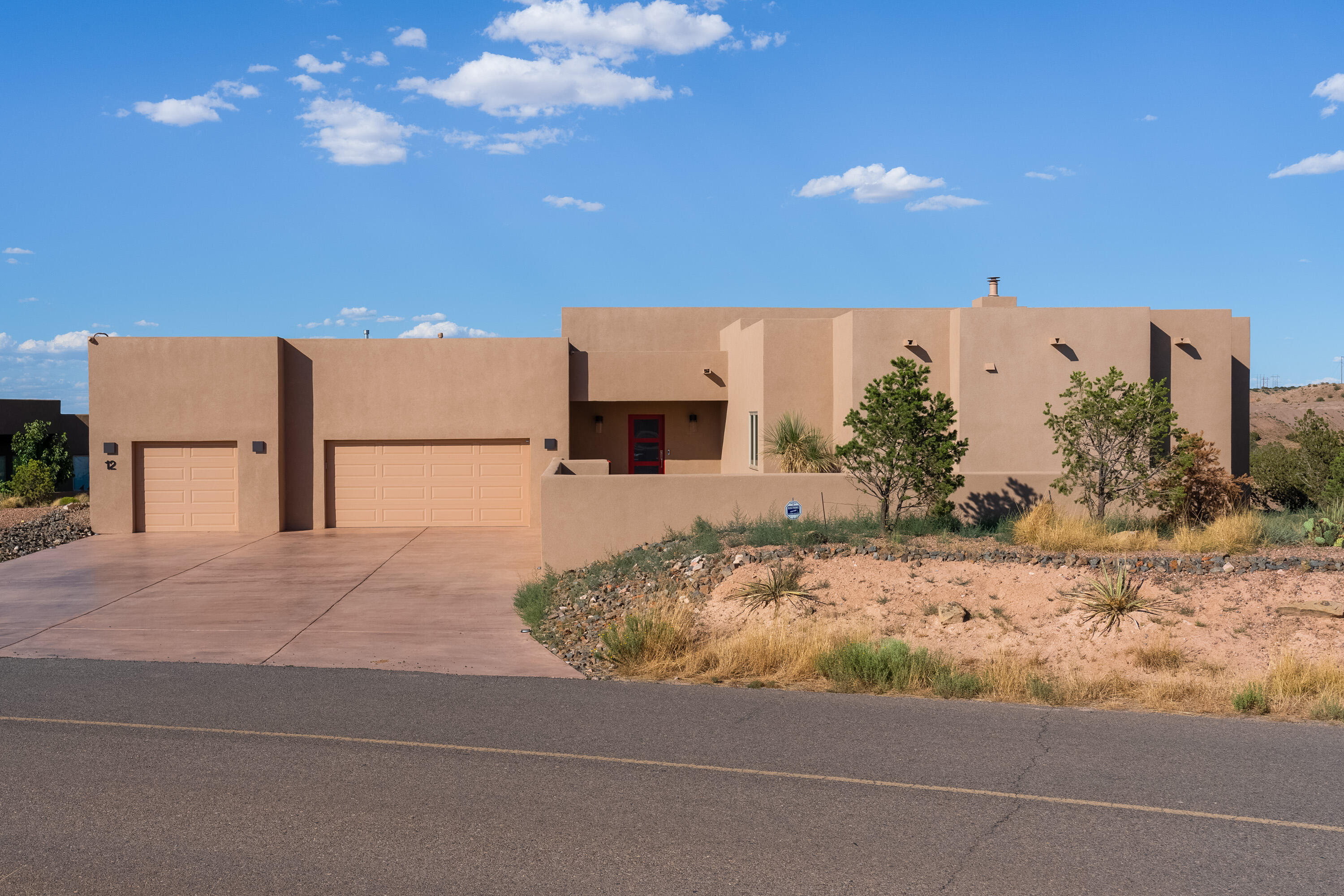 Introducing this stunning contemporary Dream Home! Built in 2022,this spacious 1-acre lot offers breathtaking views of the Sandia mountains. With 3br,3ba, 3 car oversize garage. The Kitchen is equipped with high end appliances, including Subzero, Wolf oven, Fisher-Paykel dishwasher, Wolf microwave. The upgraded tile in the kitchen adds a touch of elegance. Throughout the home ,you'll find hunter Douglas power shades, Le Grande switches,& outlets, showcasing the attention to detail. A high-end Maytag washer & dryer are included for your convenience. This home also includes an alarm system, ring doorbell, & eight exterior cameras for enhanced security. The epoxy courtyard & patio floors add a touch of style. With numerous upgrades ,this dream home is ready for you to make it your own.