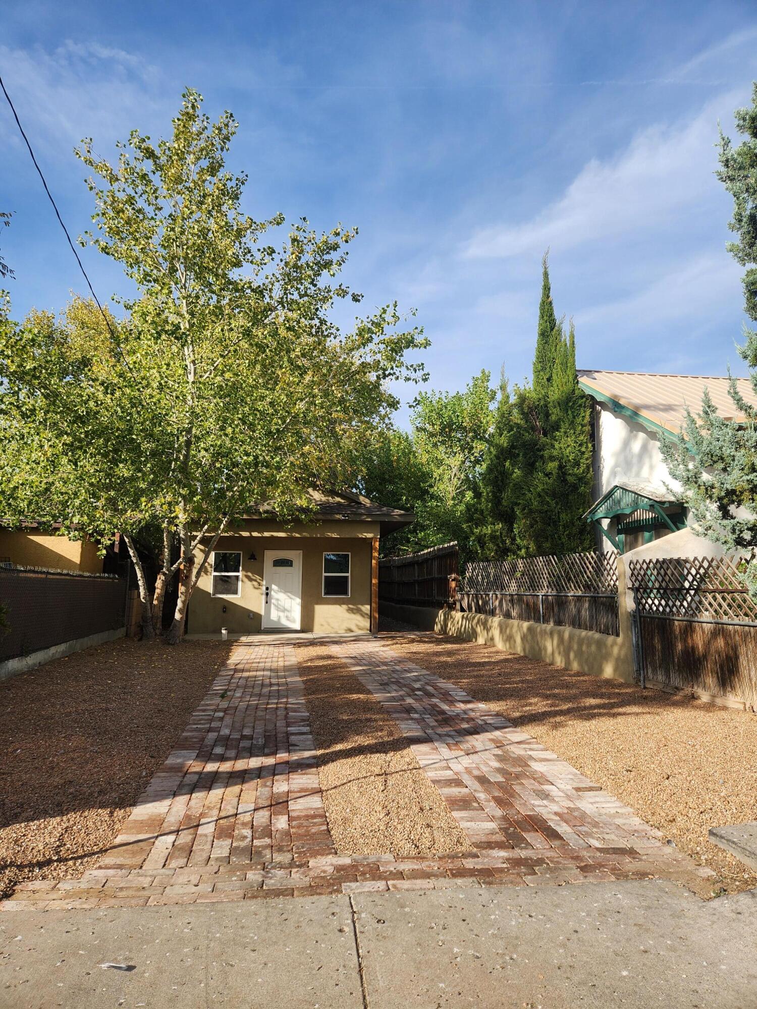 Modern convenience  in Old Albuquerque.  This complete adobe remodel is in the heart of Barelas, next to Downtown, one block from Bosque bike trails, one  block from the Hispanic Cultural Center, two minutes from I-25, 7 minutes from the airport and convenient to hospitals.  Amenities include the original coved plaster ceiling, new granite counter tops, new plumbing, new electric, new  skylights, new HVAC,  new roof, and new structure on the top, front and back.A spacious interior surprises guests entering this humble eclectic Northern New Mexico style adobe house.  This is essentially a brand new adobe home in the heart of Albuquerque.Reasonable offers include window blinds and automatic gate at driveway entrance.